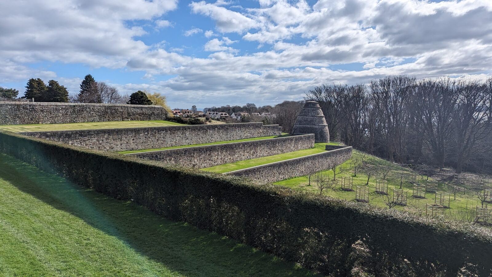 The terraced garden of Aberdour Castle stepping down toward the Forth.