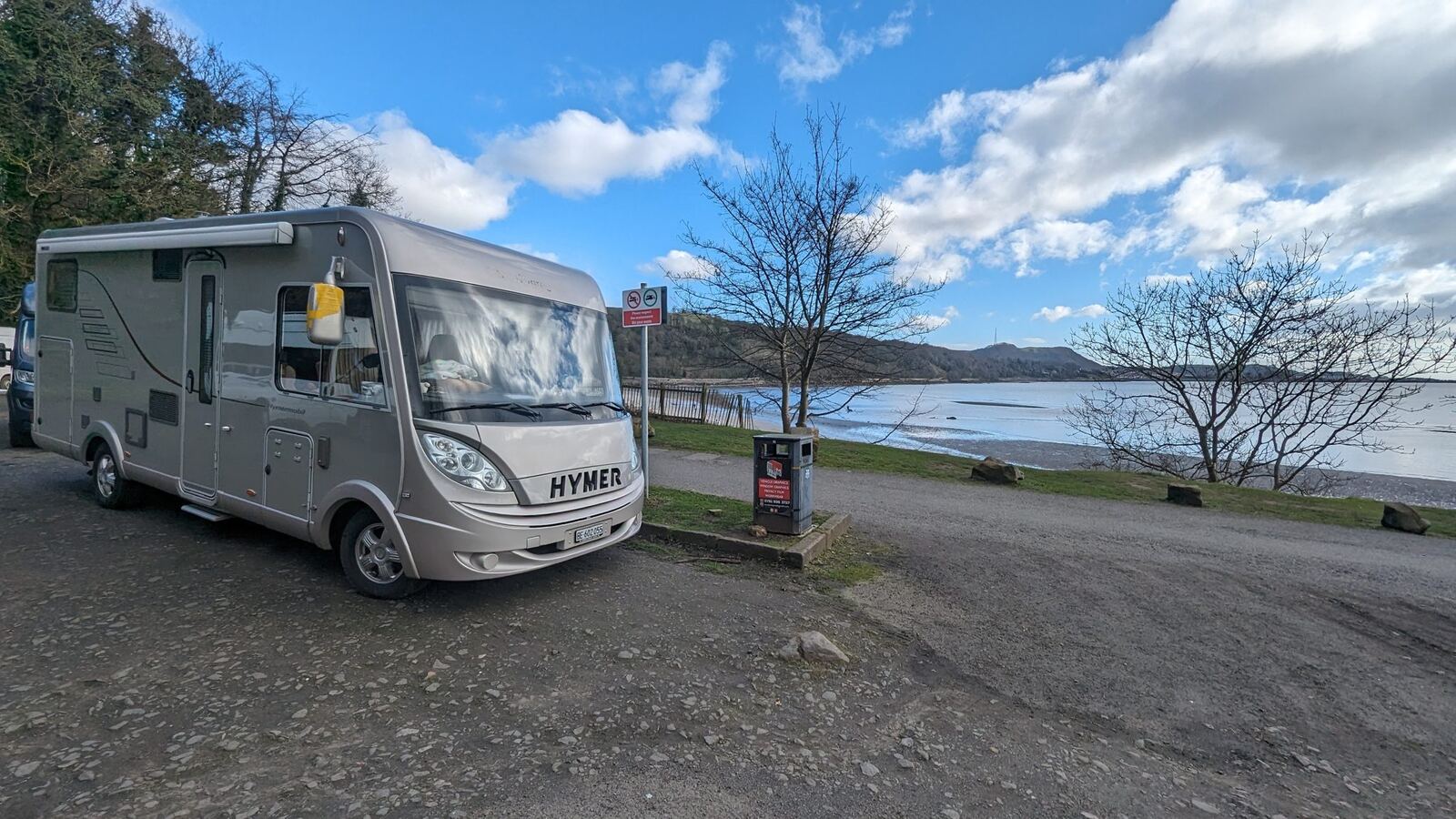 A motorhome parked at a quiet coastal spot by the Firth of Forth at Aberdour.