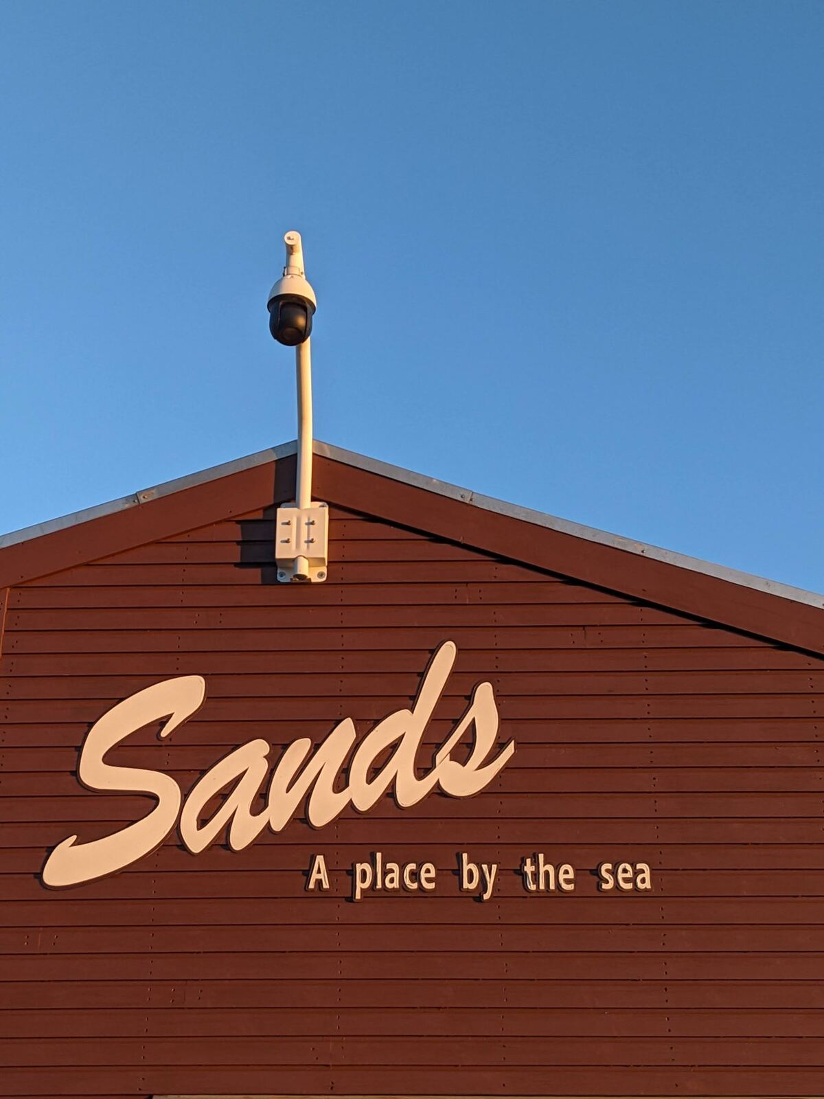 The 'Sands — a place by the sea' café sign at Aberdour beach.