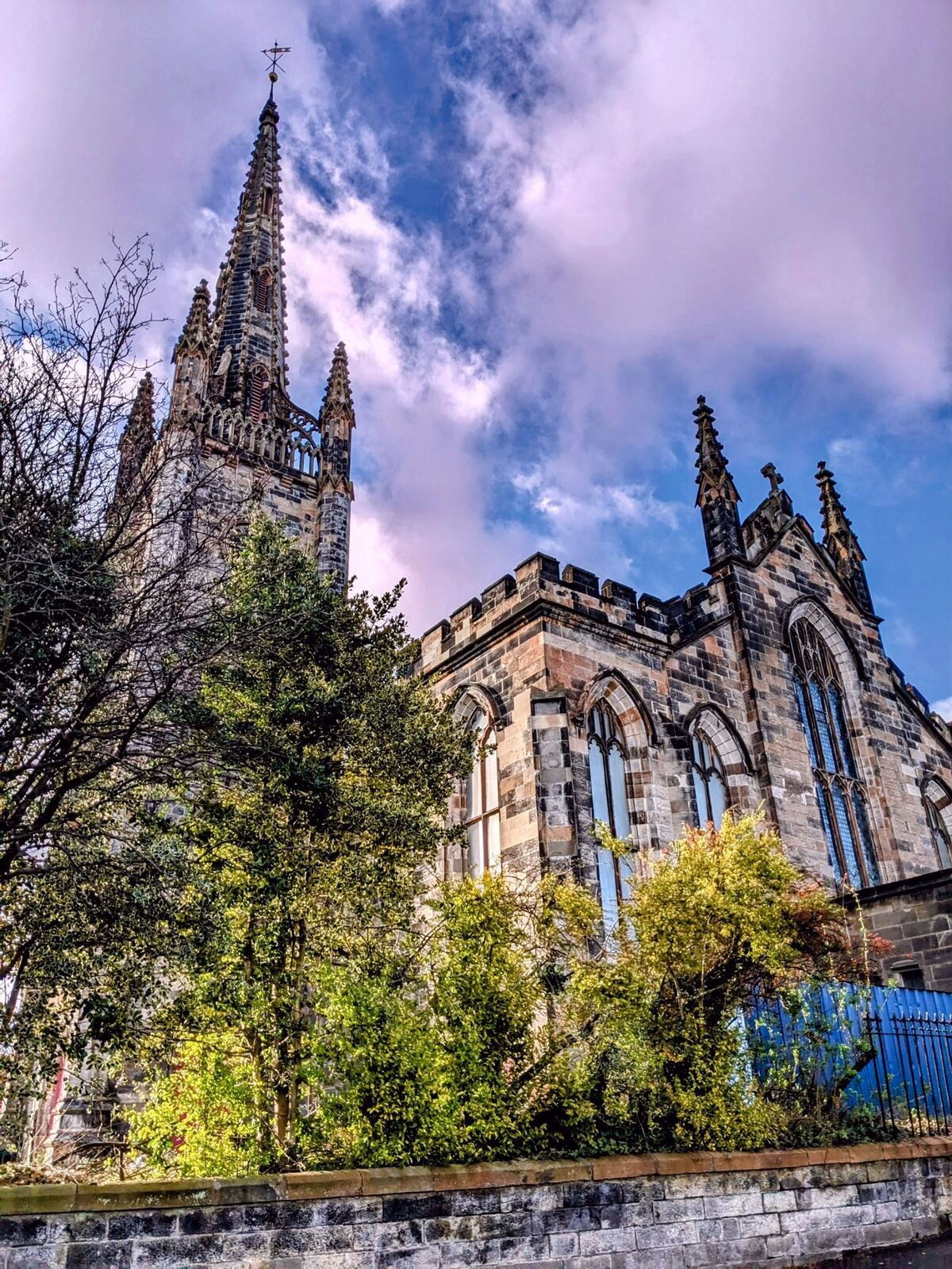 Alloa's Gothic church against a dramatic purple evening sky.
