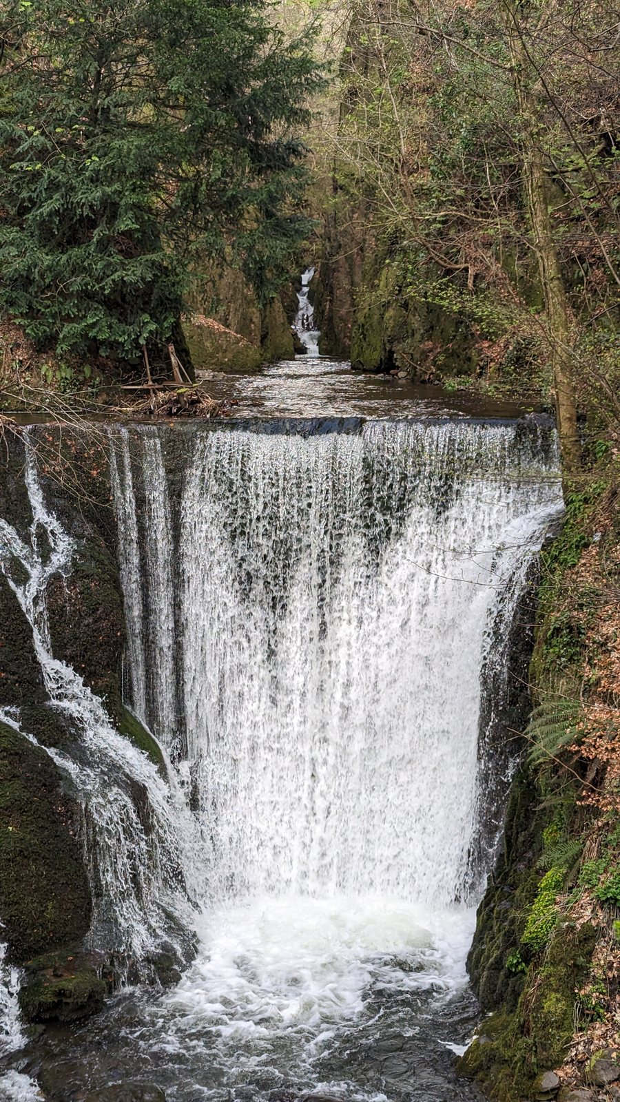 The dam and waterfall spout in Alva Glen.