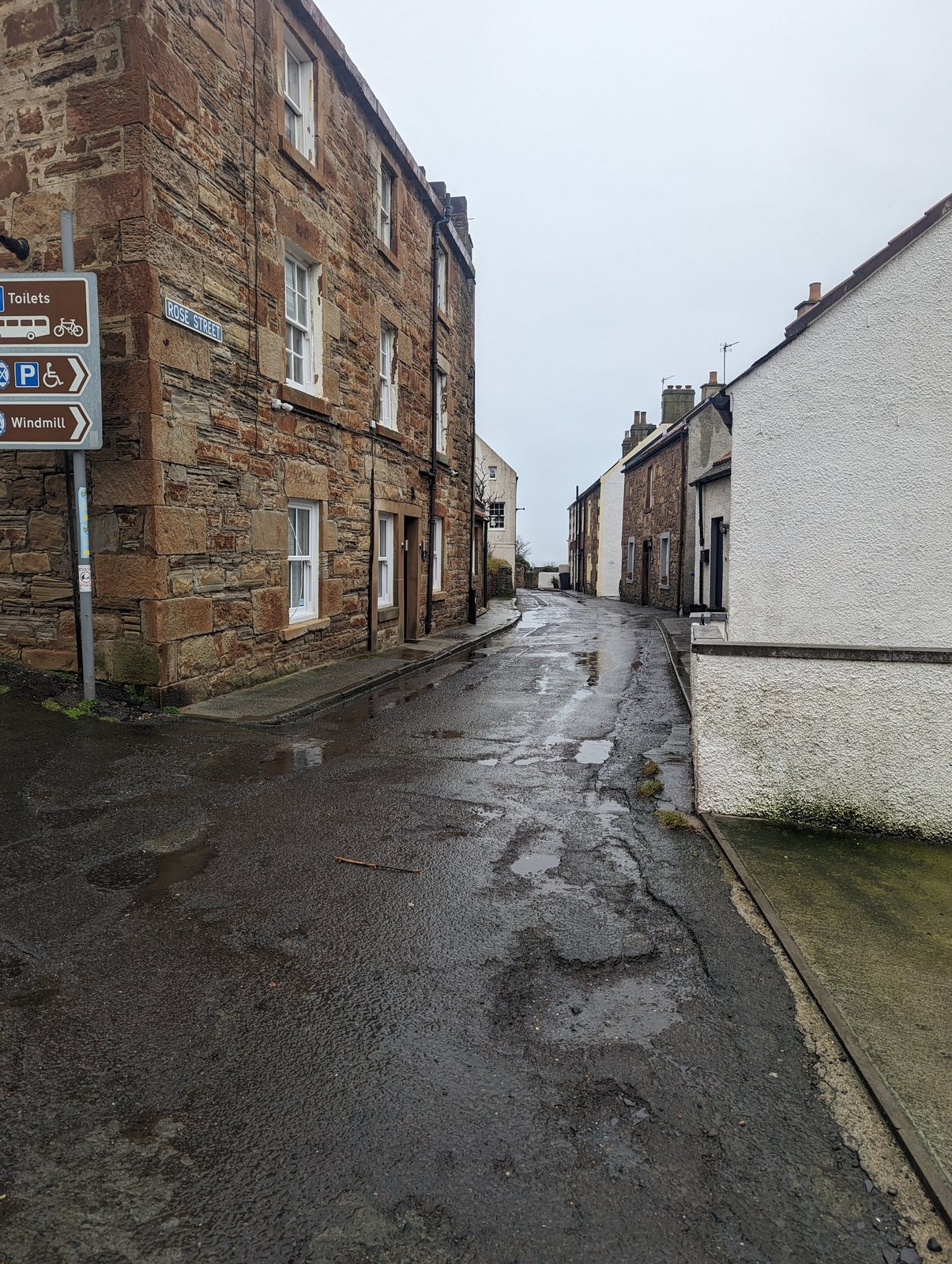 A wet cobbled street in Anstruther.