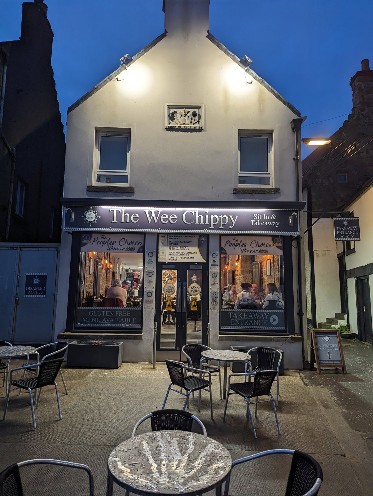 The Wee Chippy lit up at dusk, Anstruther.