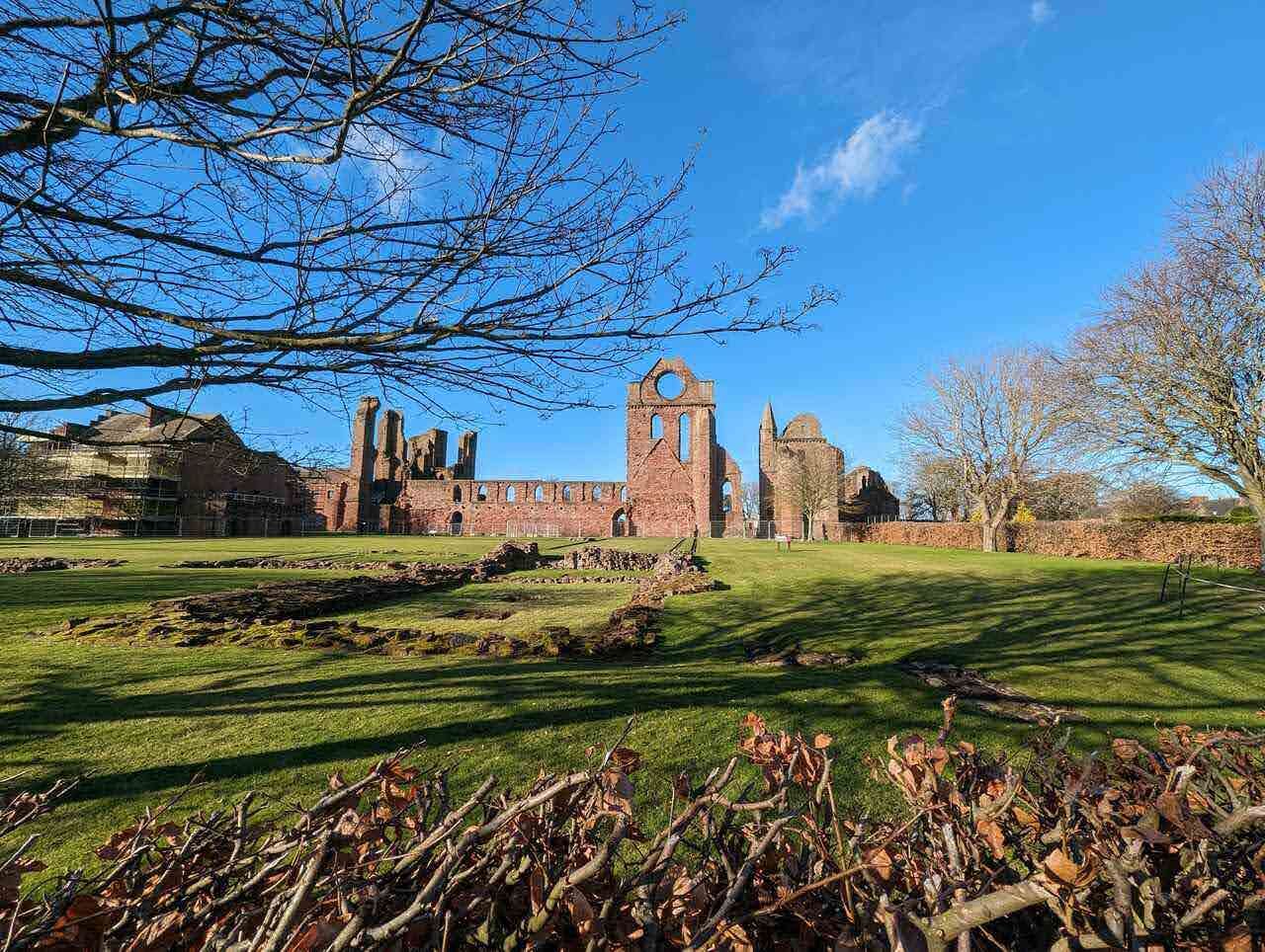 Arbroath Abbey seen across the green from the town.