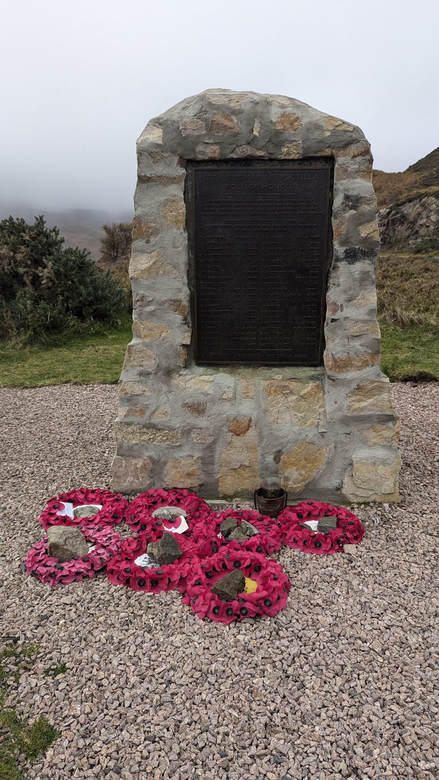 The XII Submarine Flotilla memorial at Kylesku with poppies.
