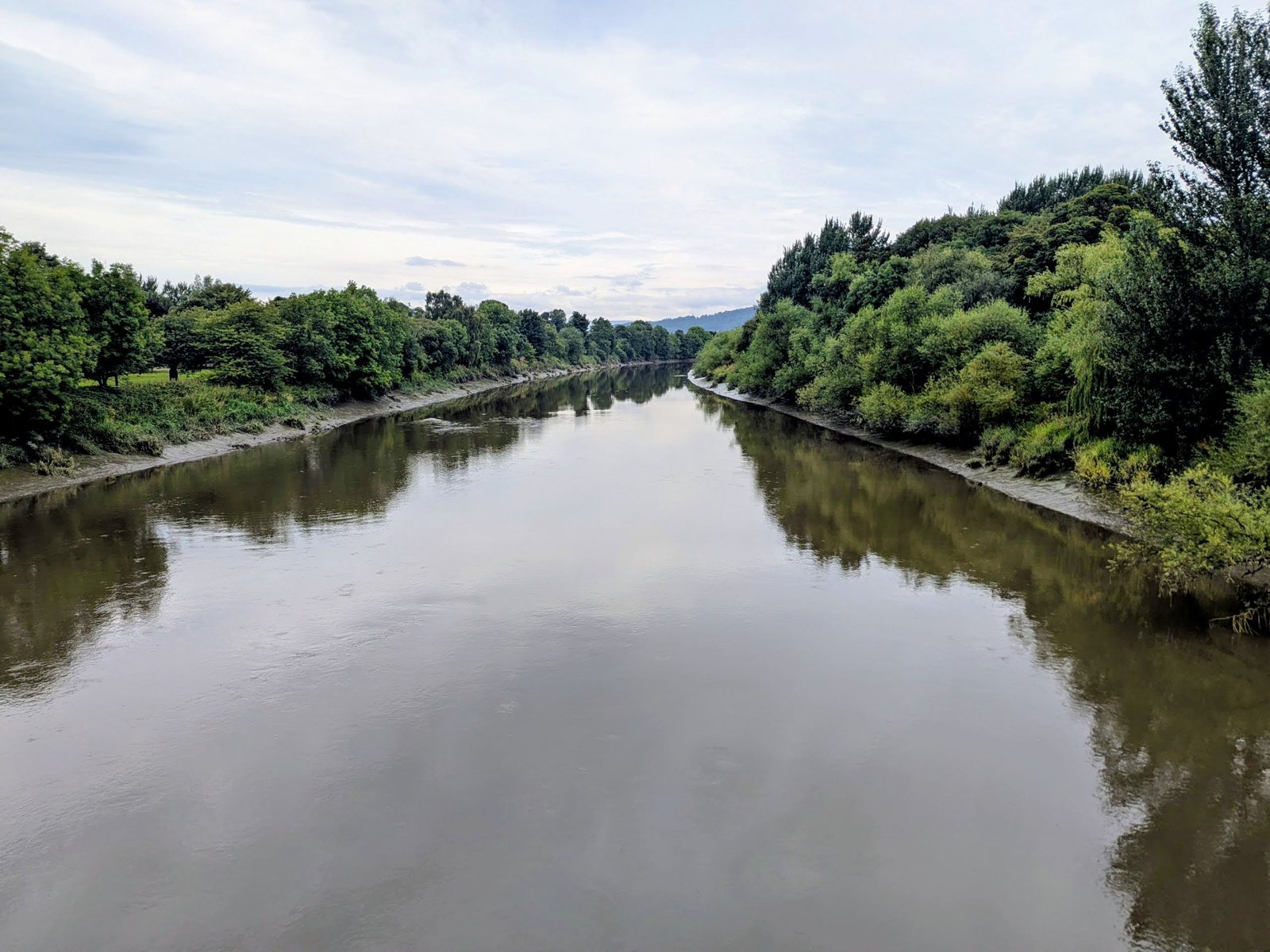 The River Forth curling in a wide loop around Cambuskenneth Abbey.