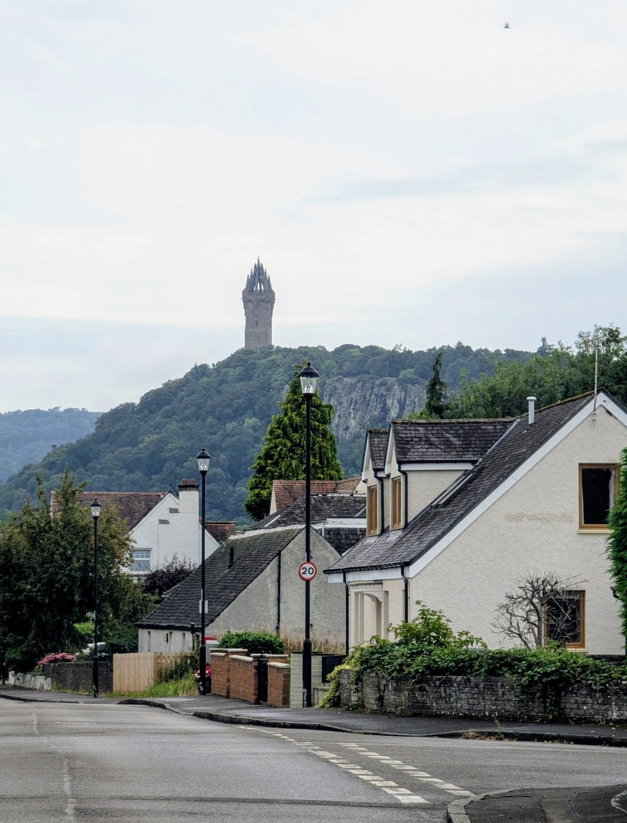 The National Wallace Monument on Abbey Craig seen above the rooftops of Cambuskenneth village.