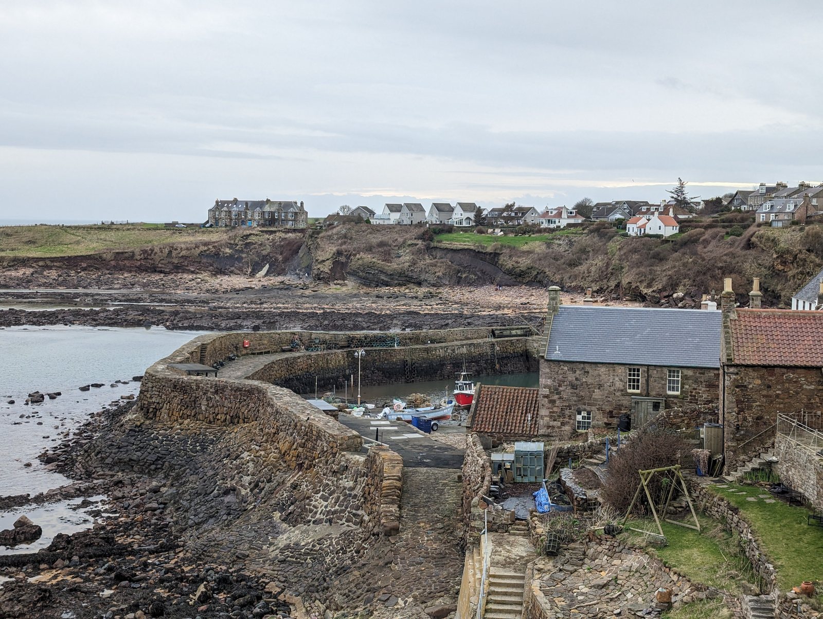 Cottages above the rocky shore at Crail on the East Neuk coast.