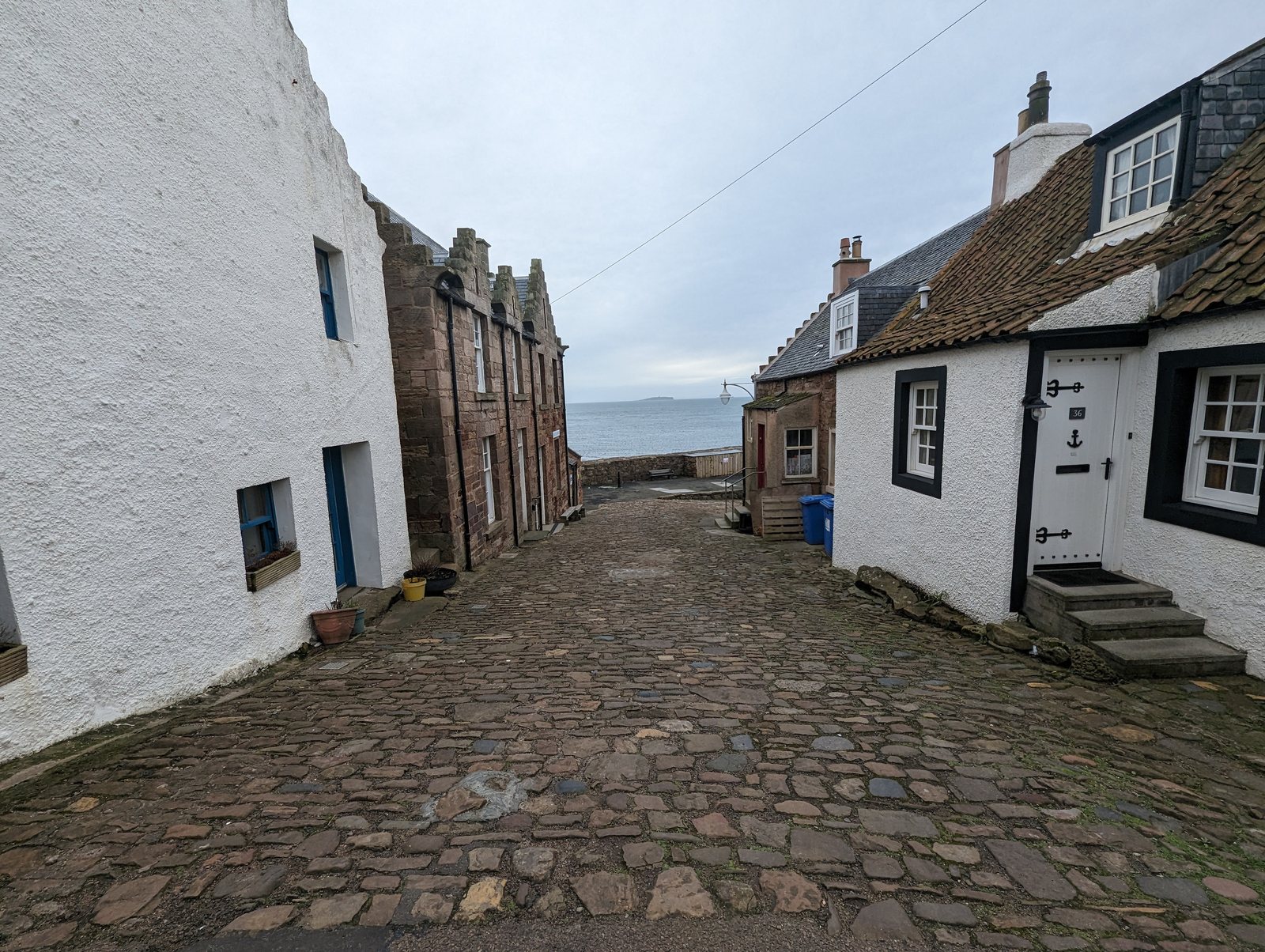 A cobbled wynd of white-washed cottages in old Crail.