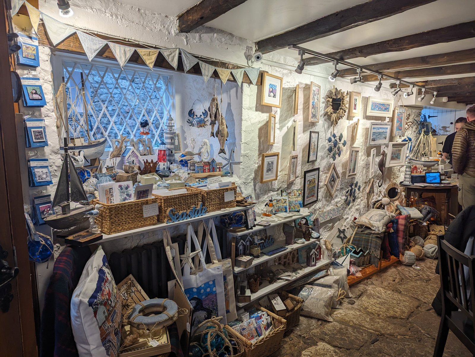 Art and crafts on the walls inside the Crail Harbour Gallery.