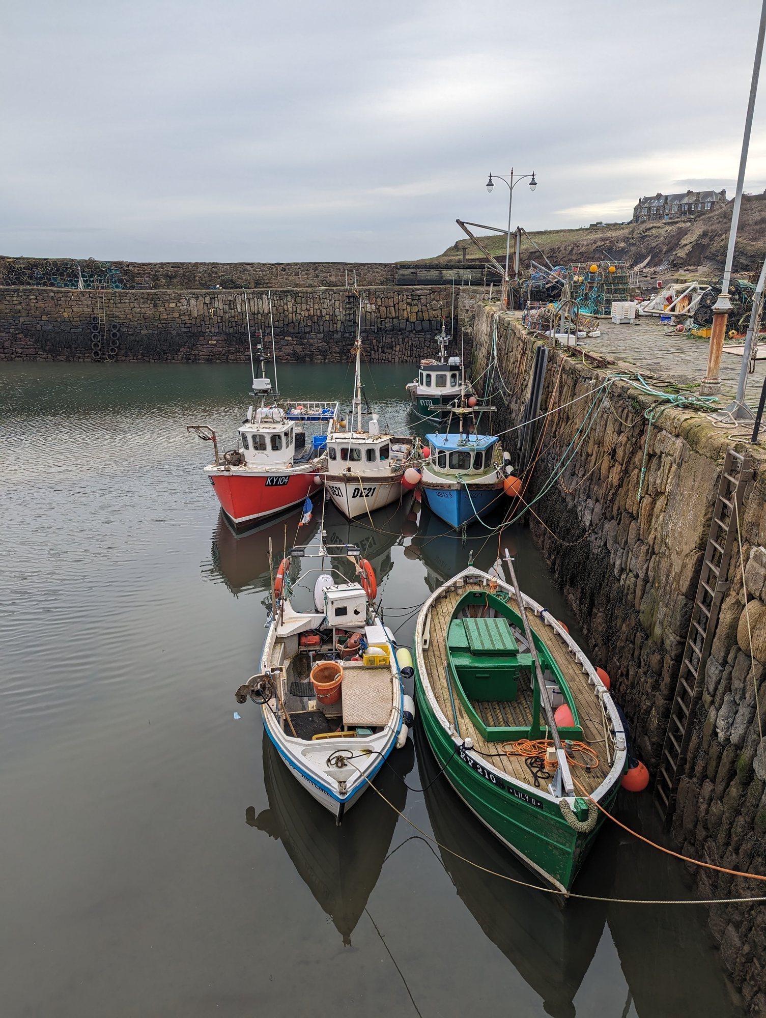 Fishing boats moored in Crail harbour, the most painted harbour in Scotland.
