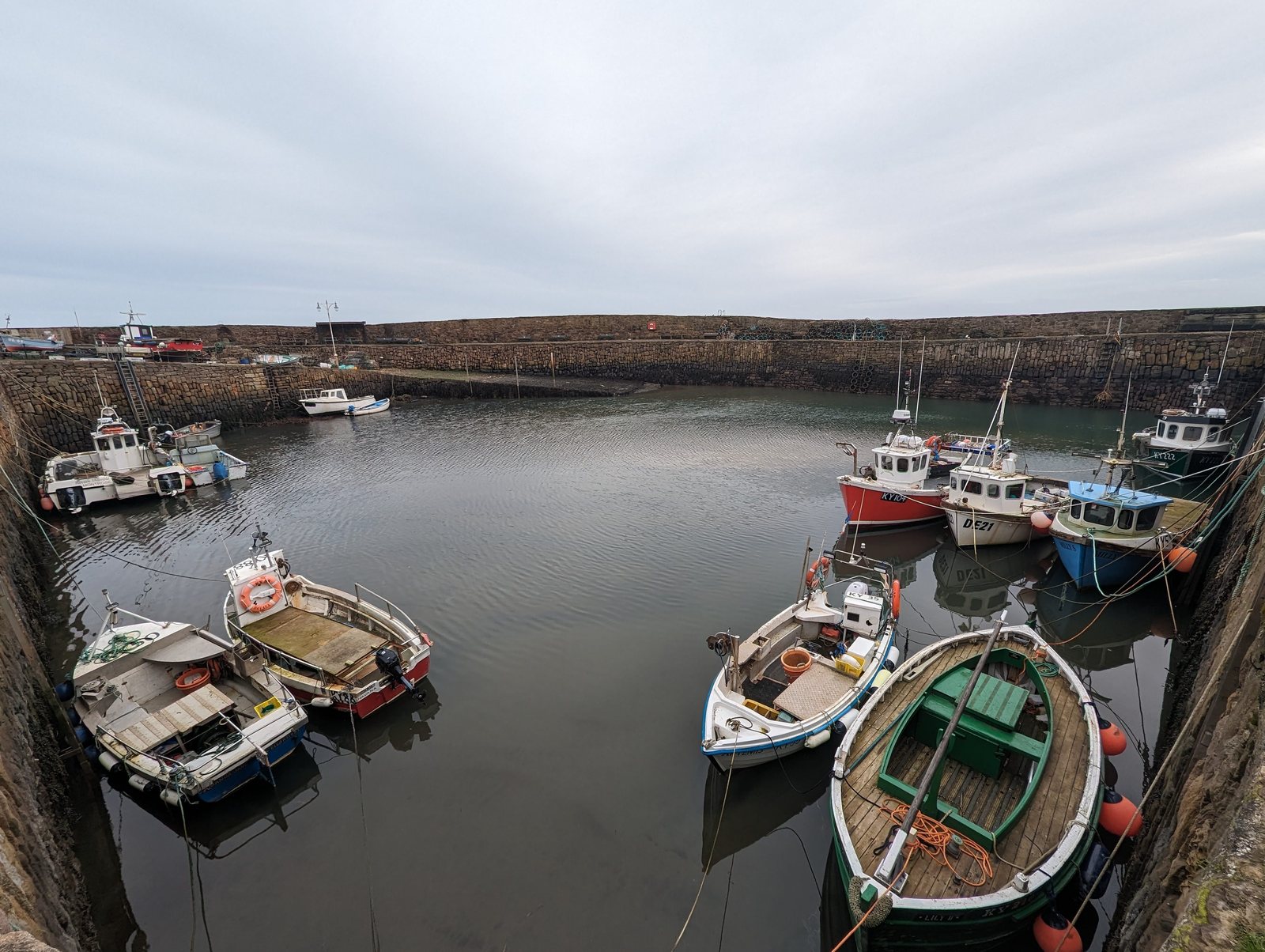 Colourful fishing boats in the small harbour at Crail, Fife.