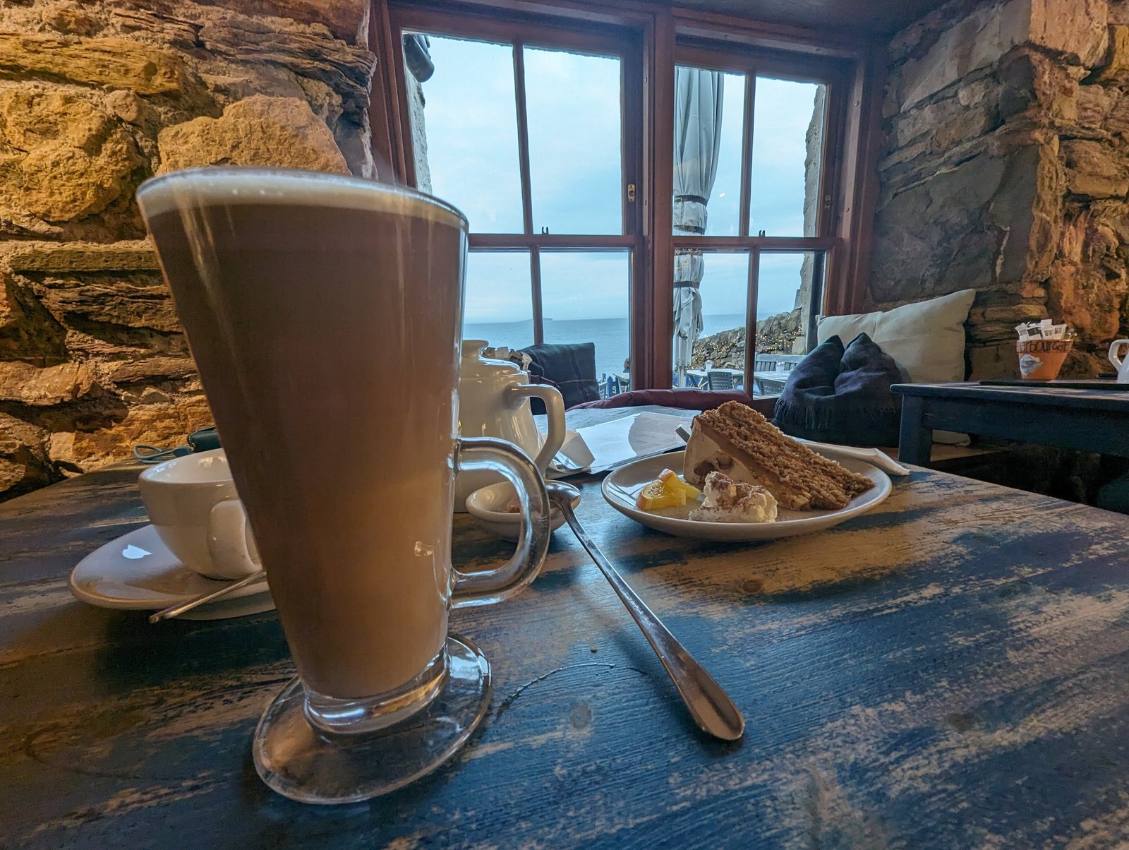 A latte and cake with a sea view at the Crail Harbour Gallery and Tearoom.