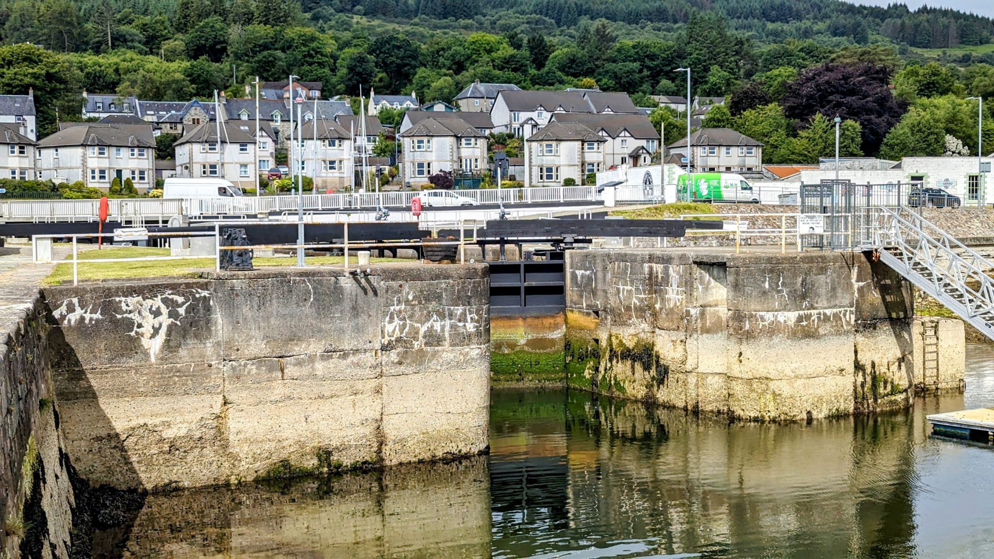 The Ardrishaig sea lock at the Loch Fyne end of the Crinan Canal, houses behind.