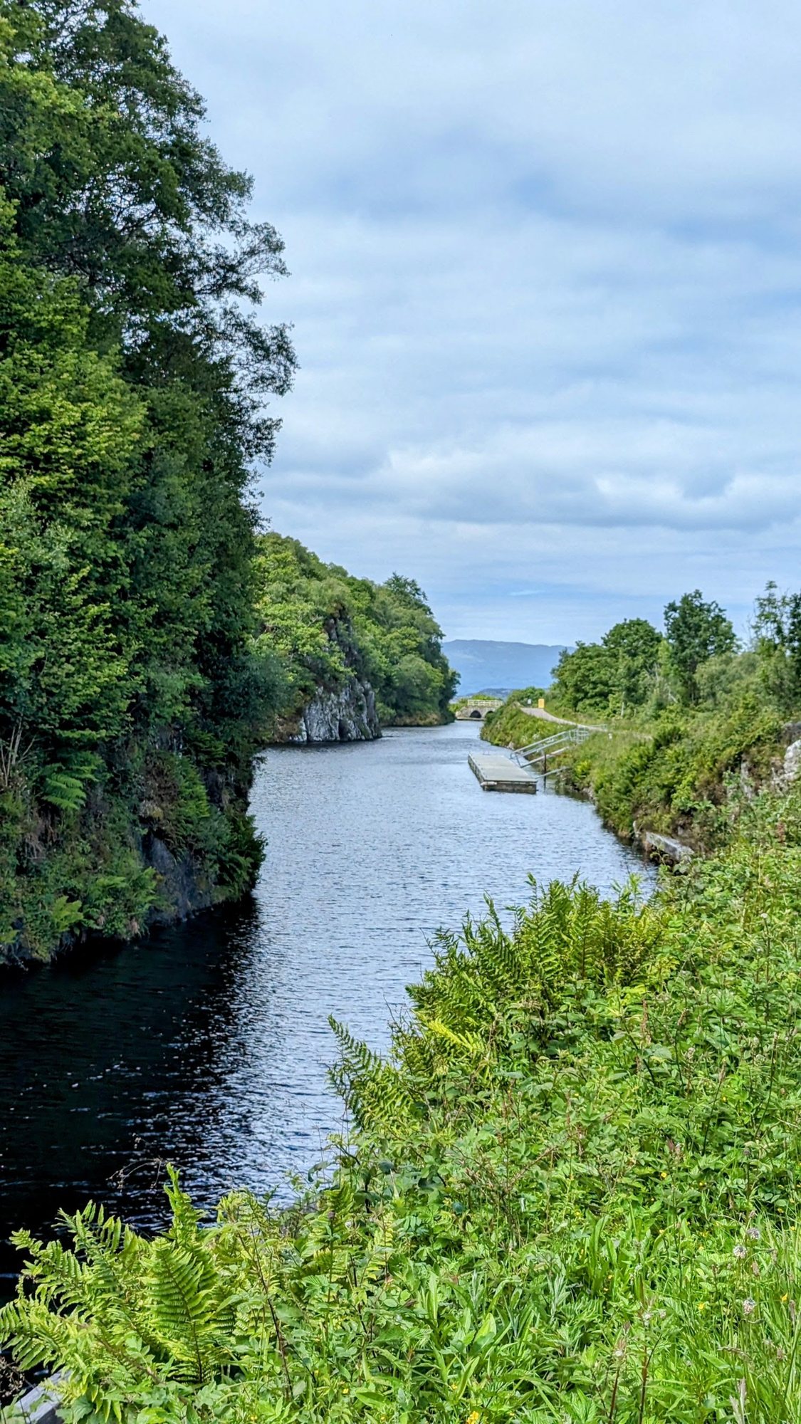 Yachts in the Crinan Canal basin below the hills at Crinan, Argyll.