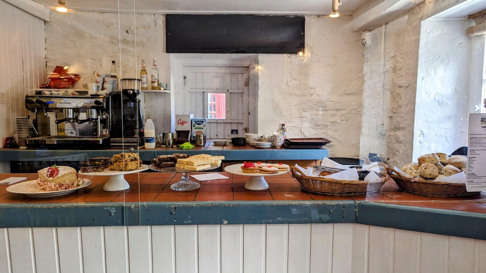 Home baking, scones and cakes laid out along the Crinan coffee-shop counter.