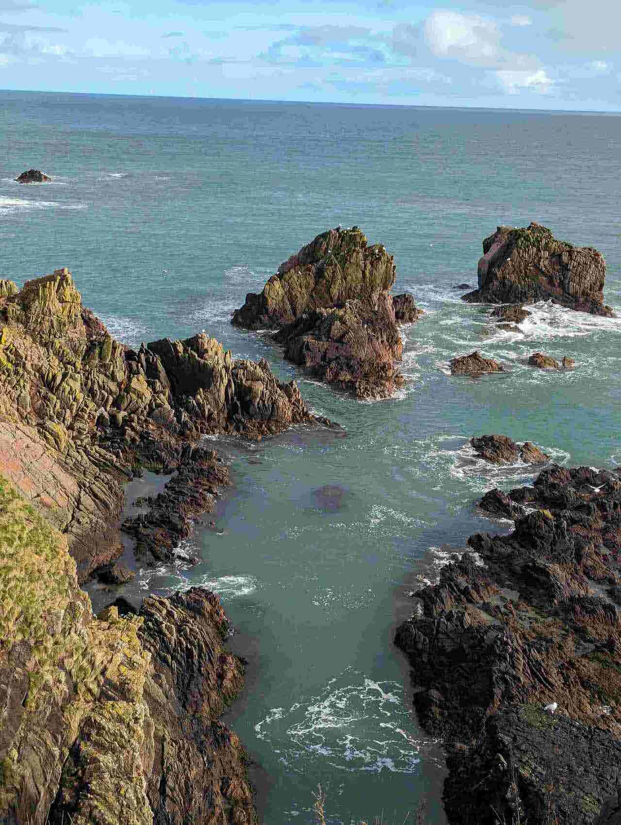 The ruin of Slains Castle above dramatic sea cliffs at Cruden Bay, Aberdeenshire.