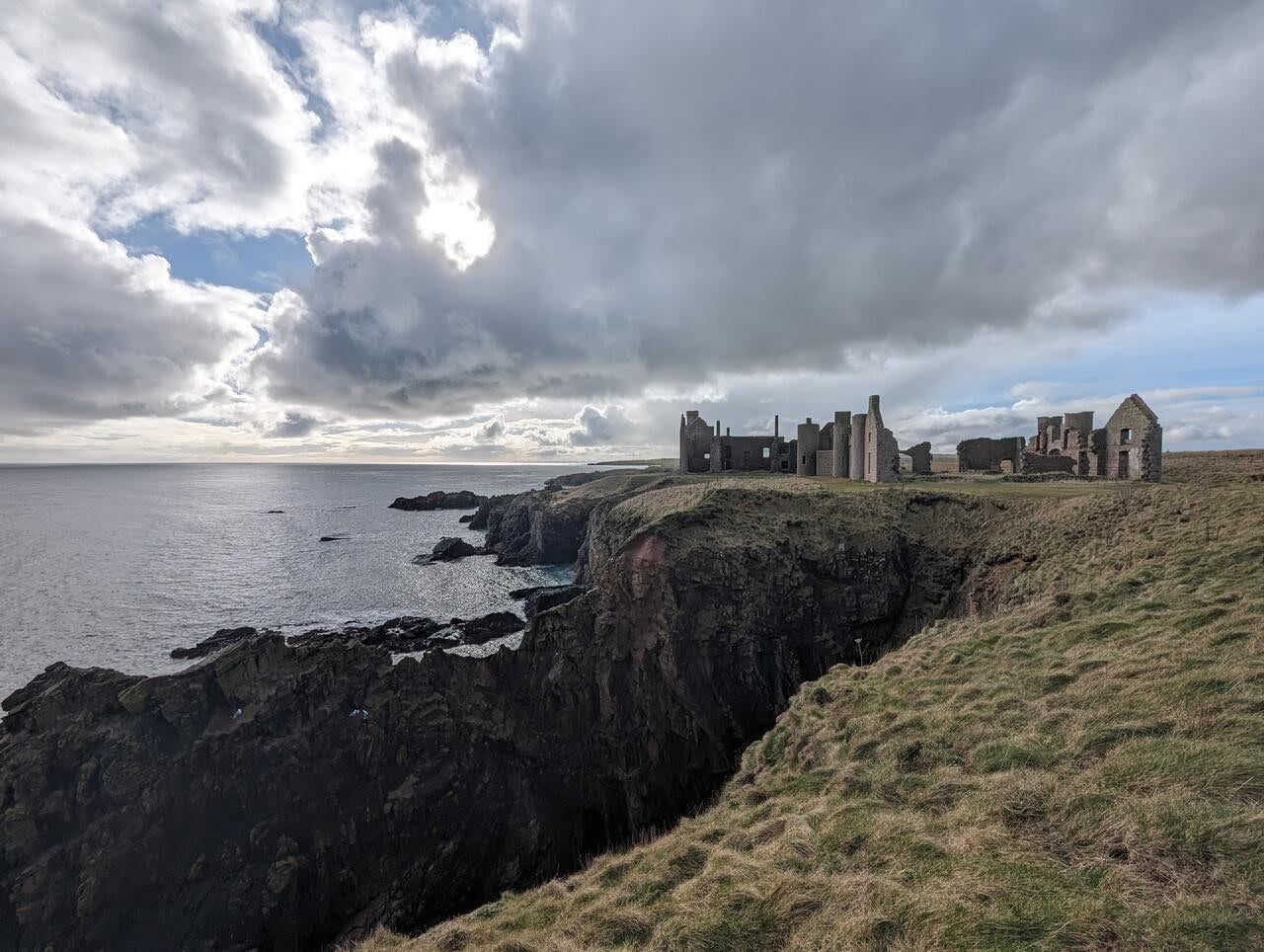 Slains Castle spread along the clifftop above the sea near Cruden Bay.
