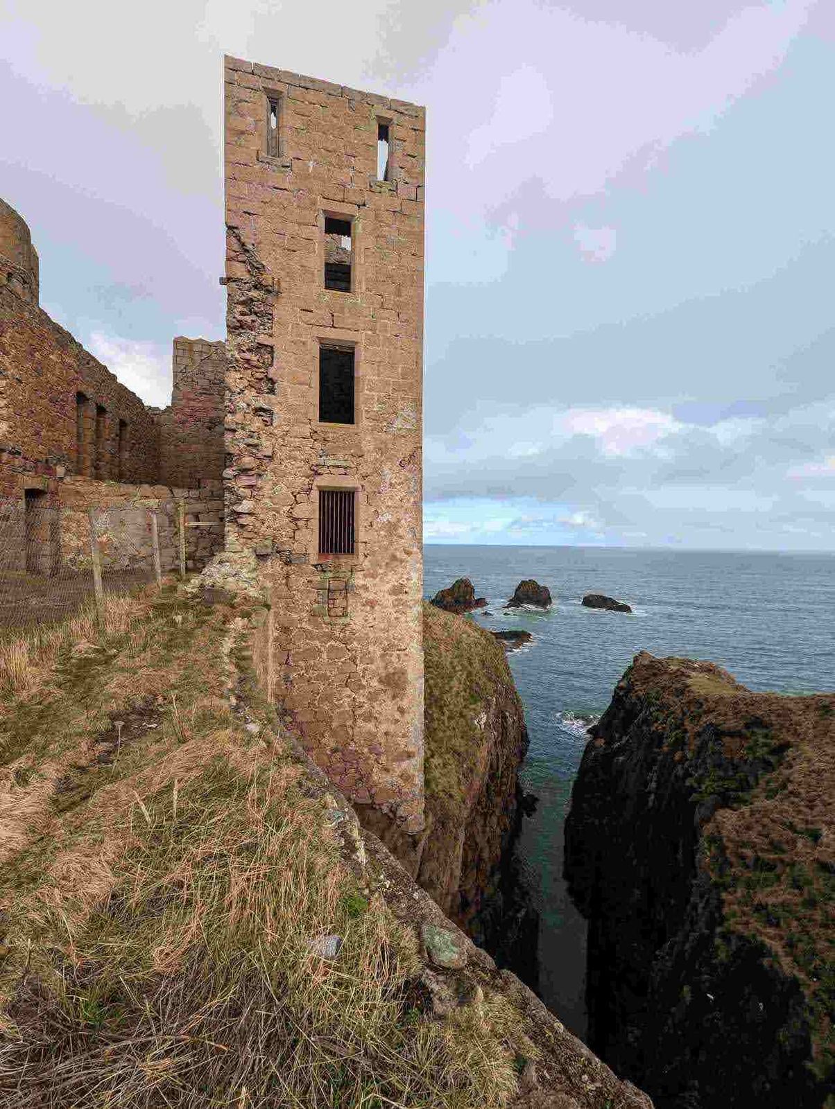A surviving tower of Slains Castle above the North Sea at Cruden Bay.