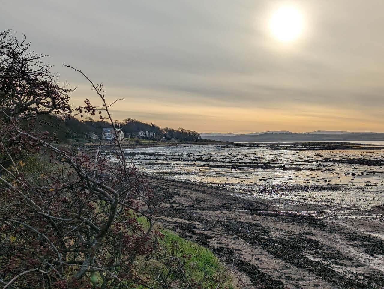 Sunset over the Firth of Forth at Culross, the far shore and hills silhouetted.