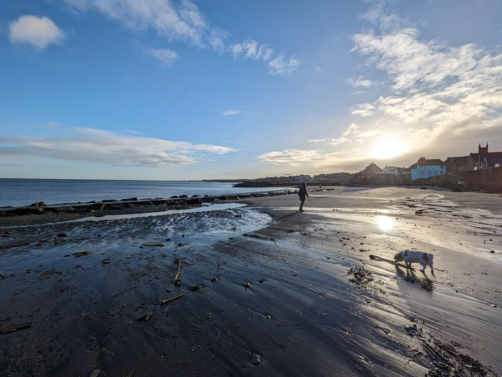 Sunset over the wide sands of Belhaven Bay near Dunbar at low tide.