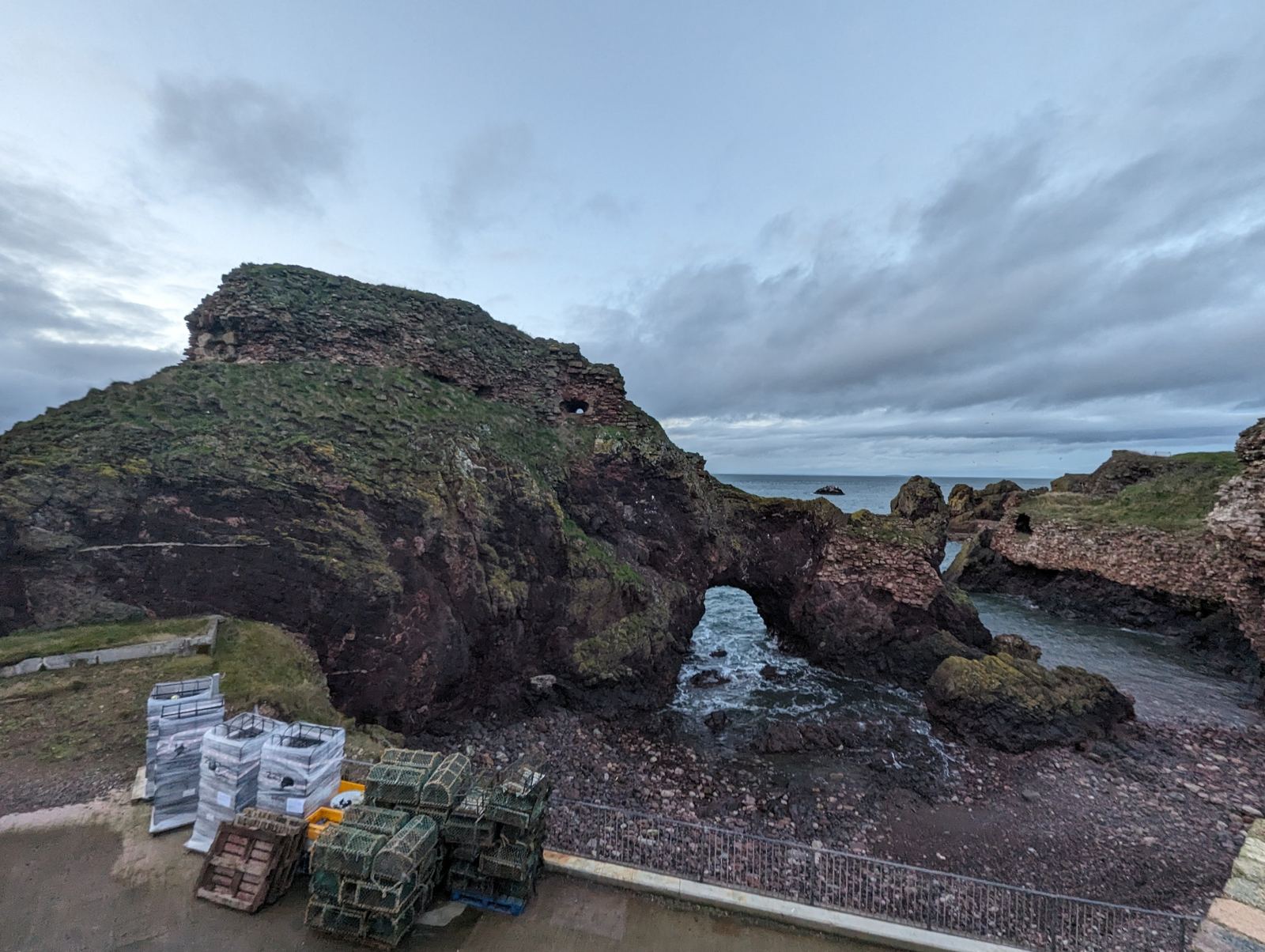 The dramatic red sandstone ruins of Dunbar Castle above the harbour.