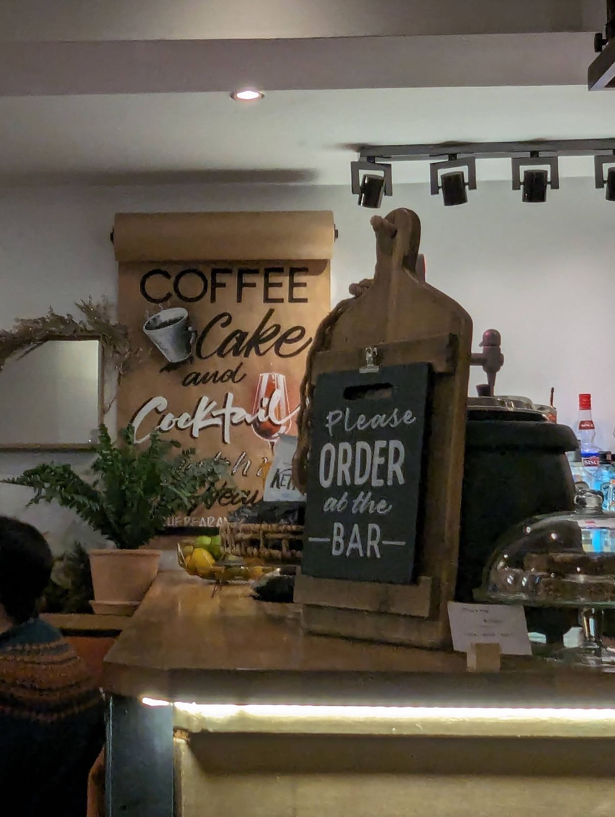 The interior of a welcoming coffee shop in Dunbar town centre, 'Coffee, Cake and Cocktails'.