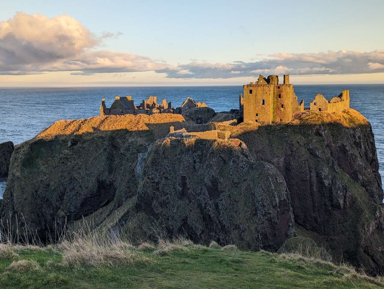 Dunnottar Castle glowing gold above the North Sea near Stonehaven.