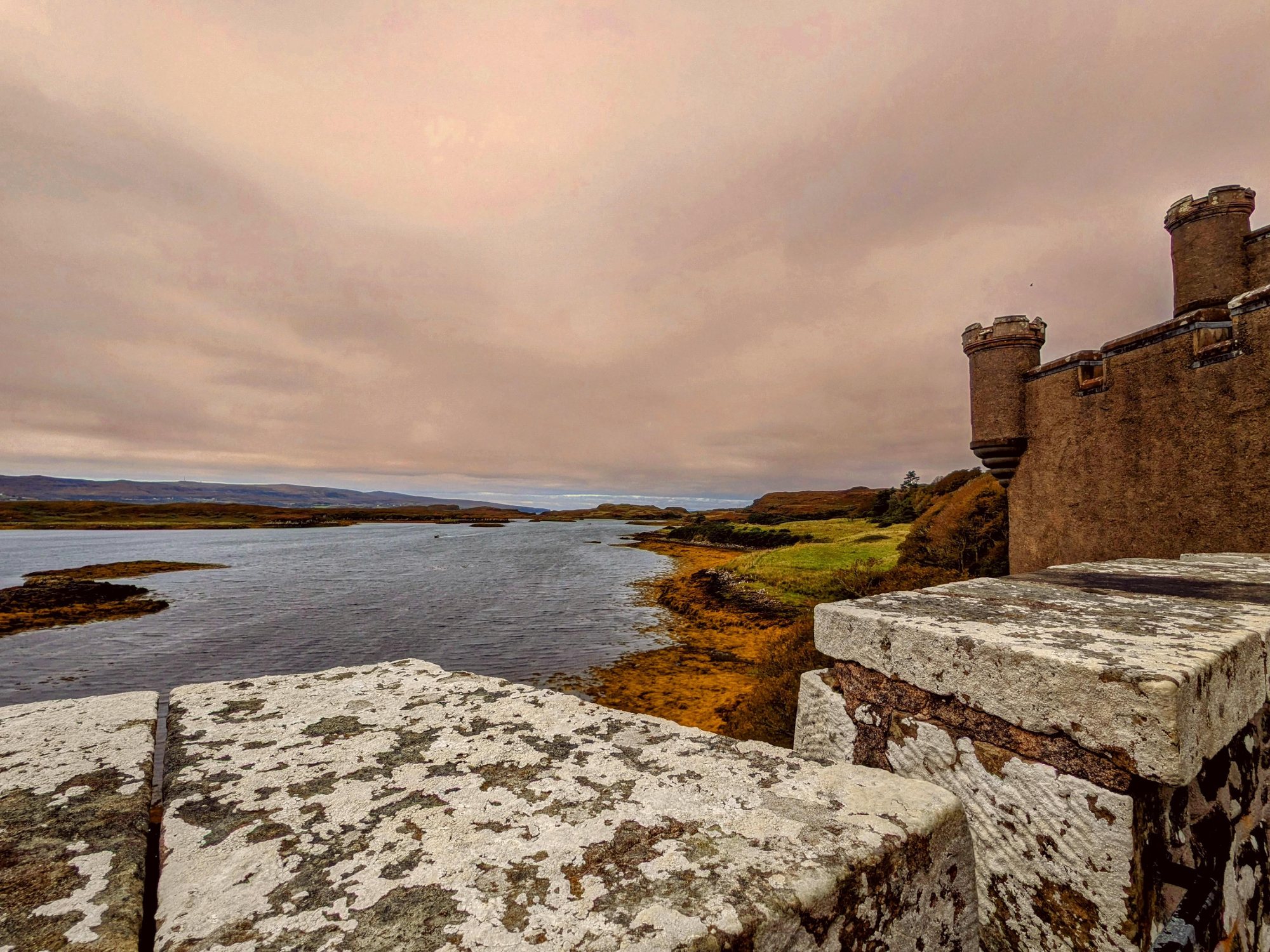 Dunvegan Castle rising above Loch Dunvegan on the Isle of Skye.