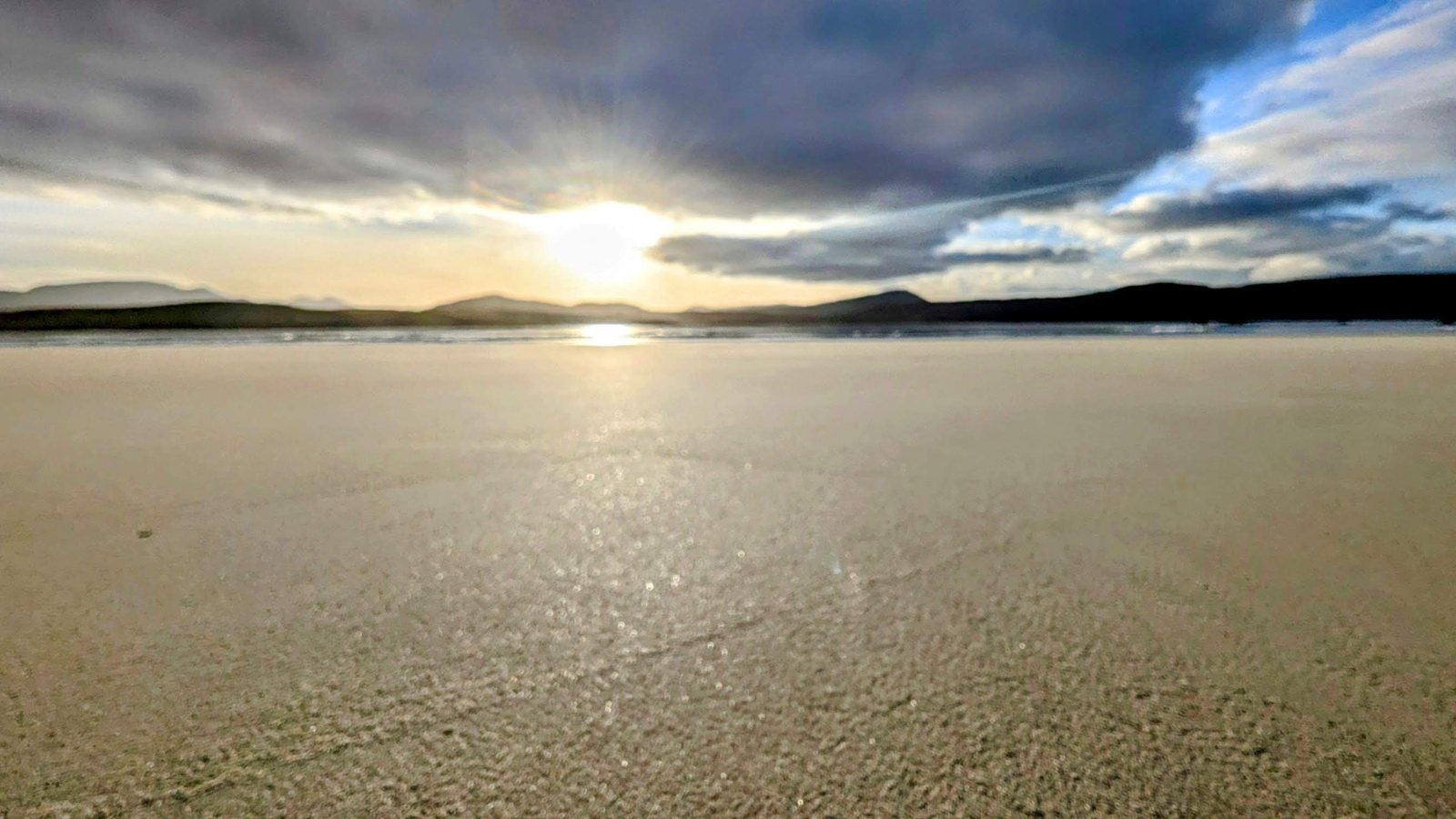 Sunset reflected on wet sand at Durness.