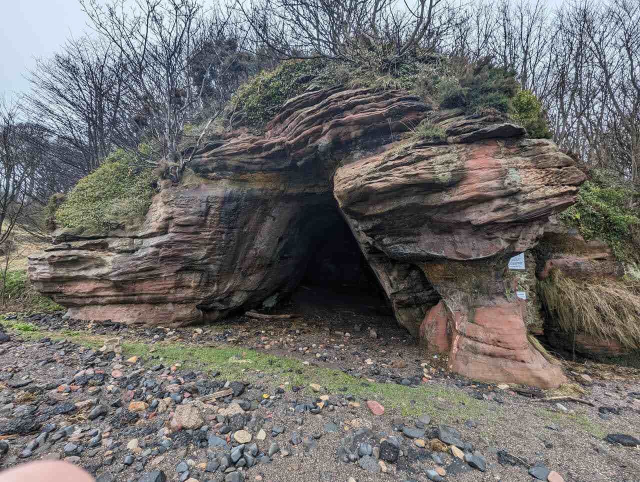 The mouth of one of the Wemyss Caves in the red sandstone shore at East Wemyss.