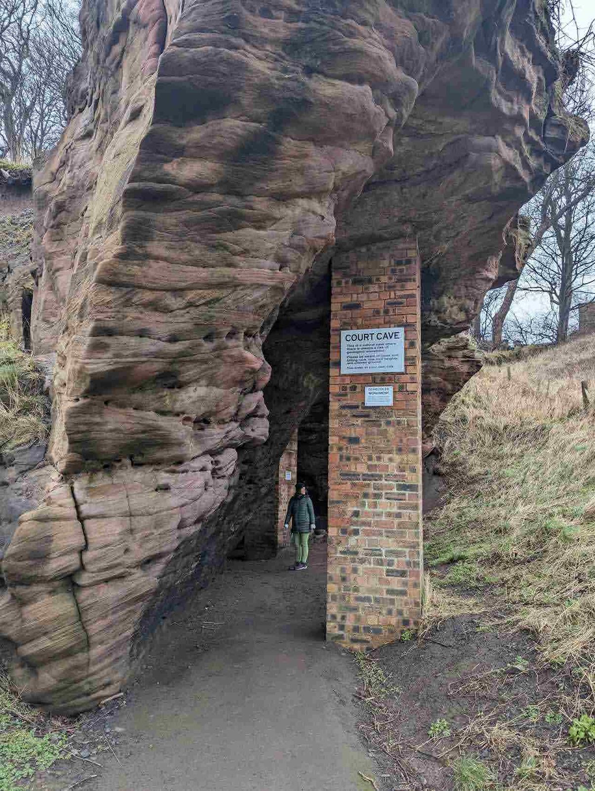 A tall sandstone sea cave at the Wemyss Caves, East Wemyss, Fife.