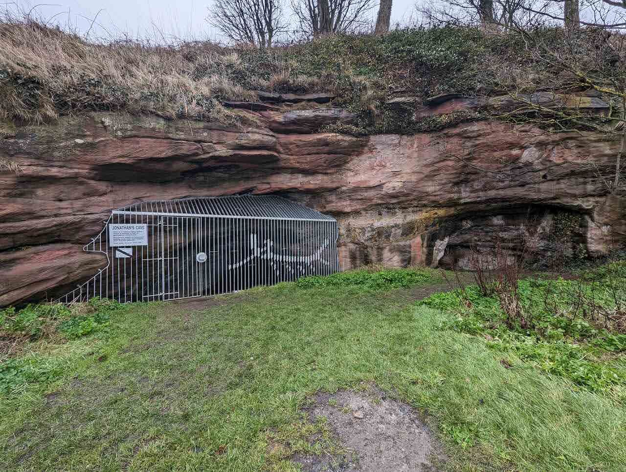 A gated cave protecting the ancient Pictish carvings at the Wemyss Caves.