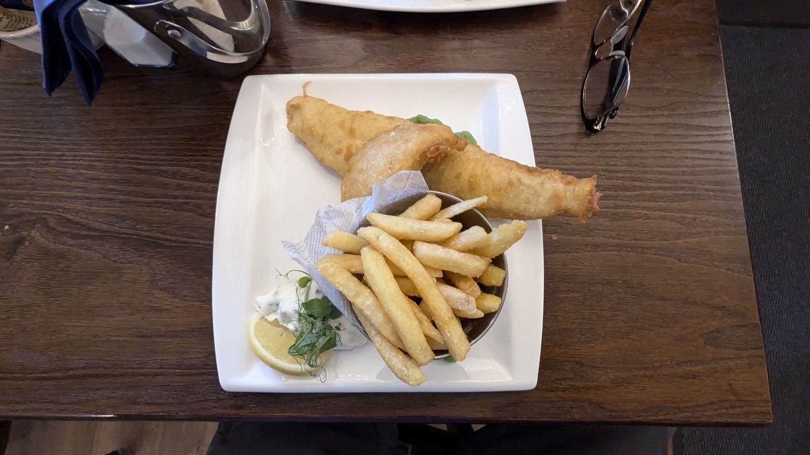 A fish supper on a plate at the Clachan pub, Dornie.