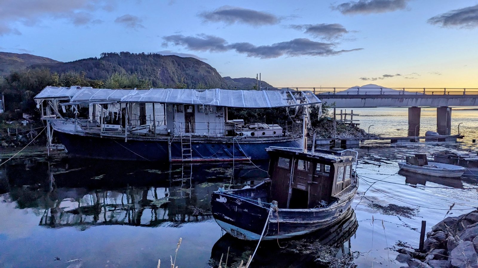 Old fishing boats at the pier in Dornie.