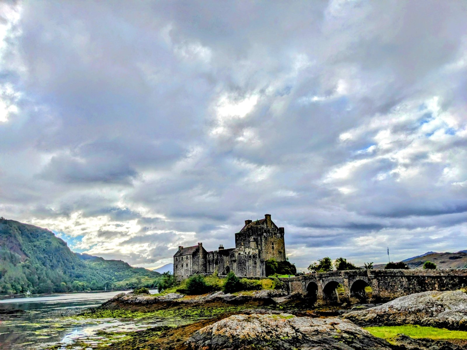 The arched stone bridge leading out to Eilean Donan Castle.