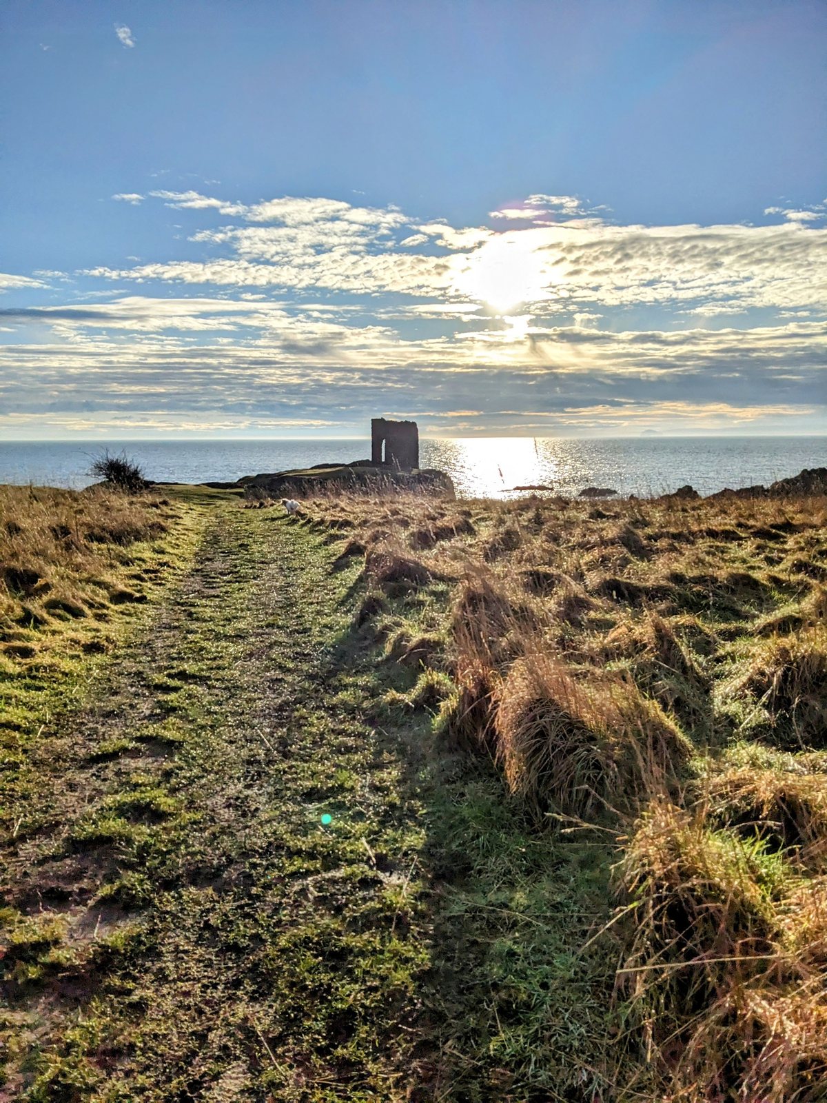 The path to Lady&rsquo;s Tower above Ruby Bay at sunset, Elie.