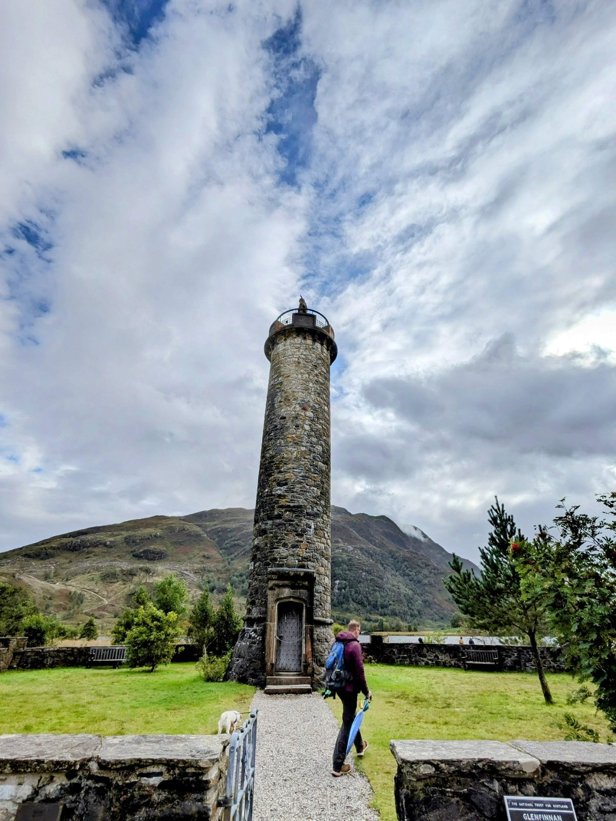 The Glenfinnan Monument, a tall tower topped by a kilted Highlander statue.