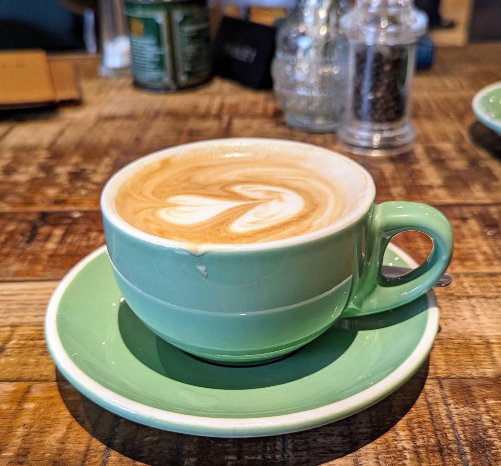 Coffee in a green cup at Brambles cafe, Inveraray