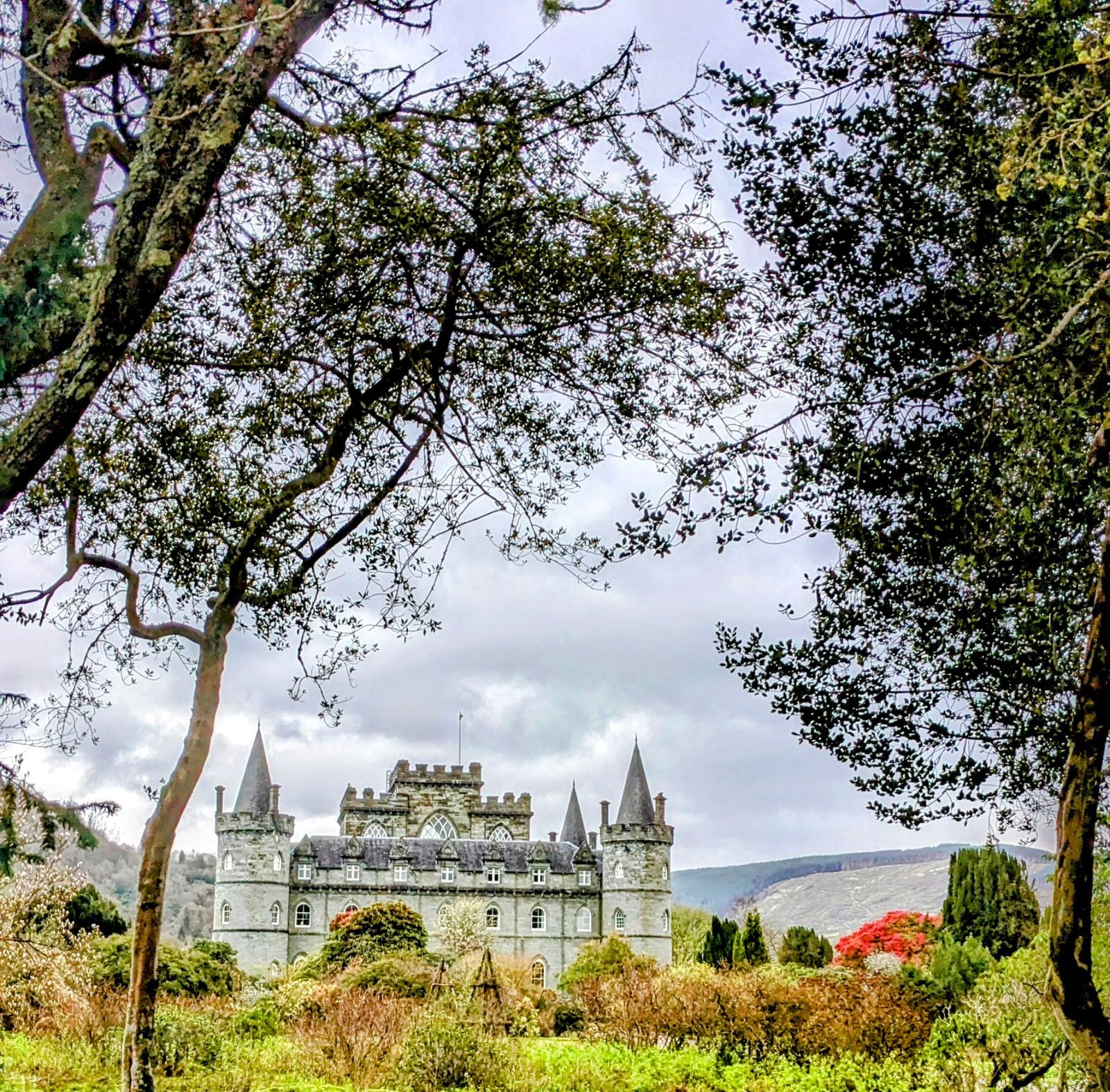 Inveraray Castle glimpsed through spring trees
