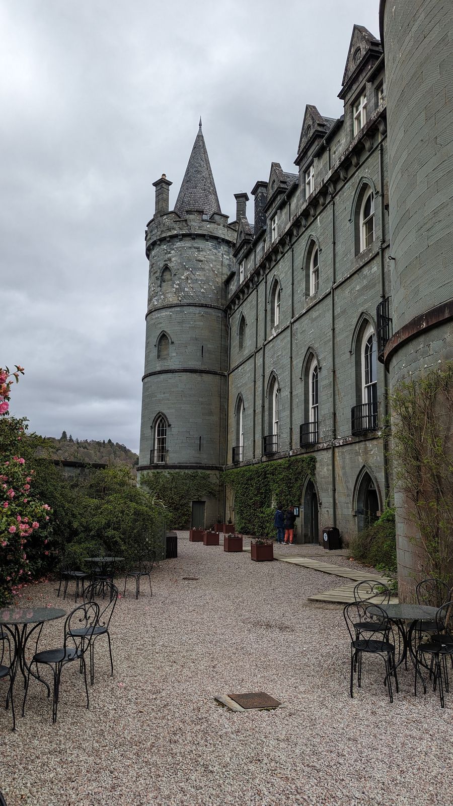 The castle courtyard cafe with tables set out below the turrets