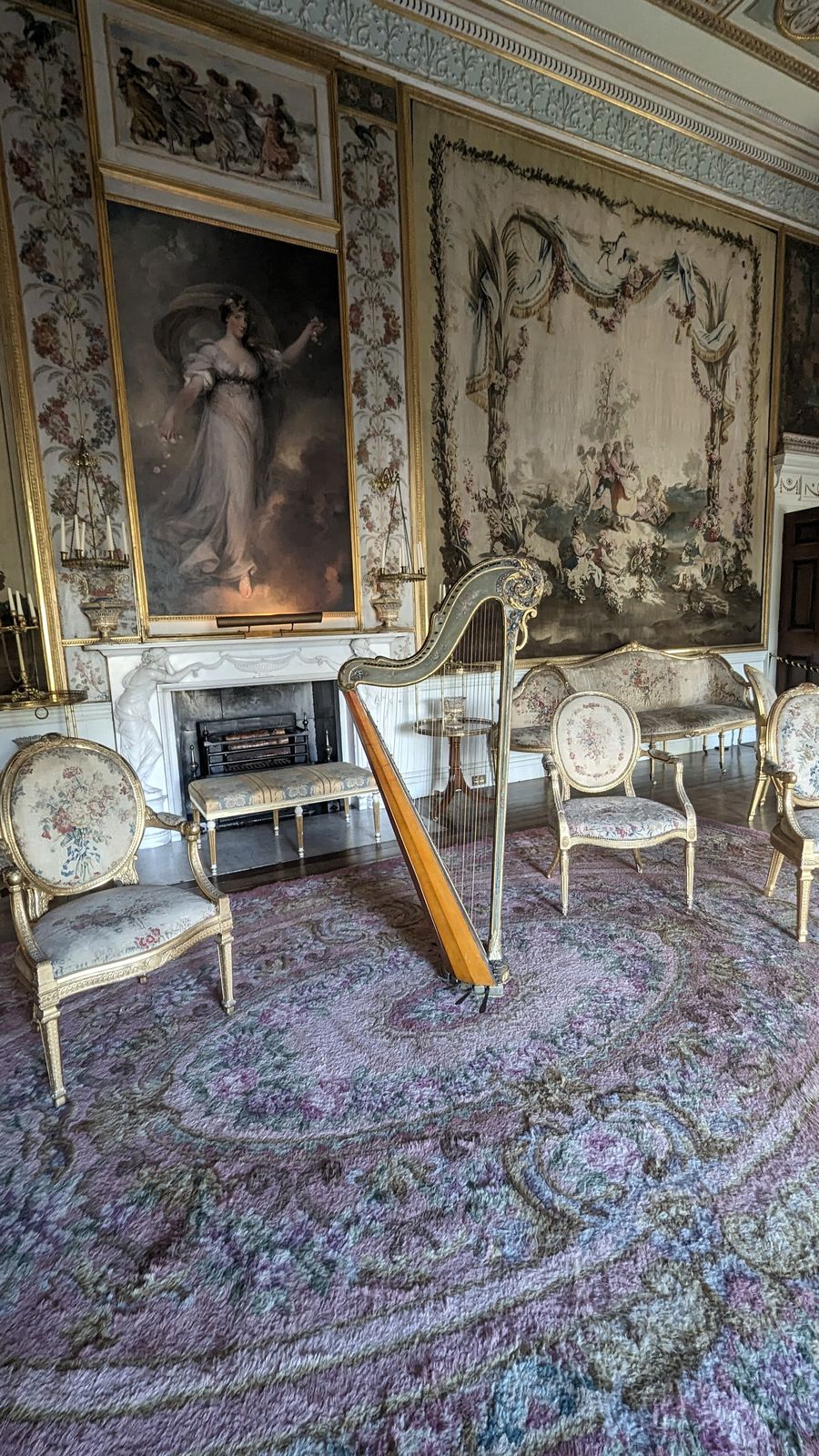 An ornate drawing room with painted panels and a portrait, Inveraray Castle
