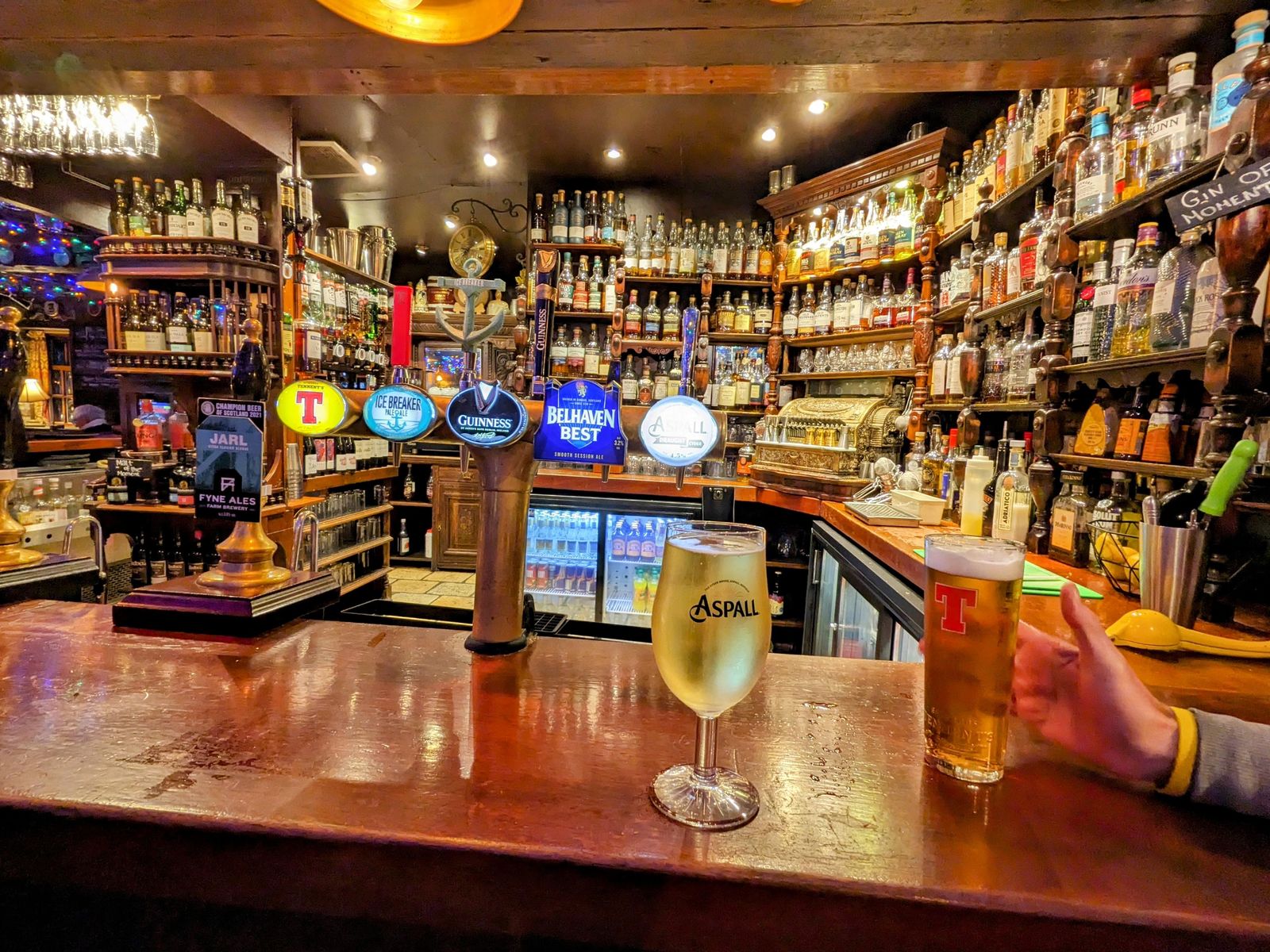A wall of whisky behind the bar in Inveraray