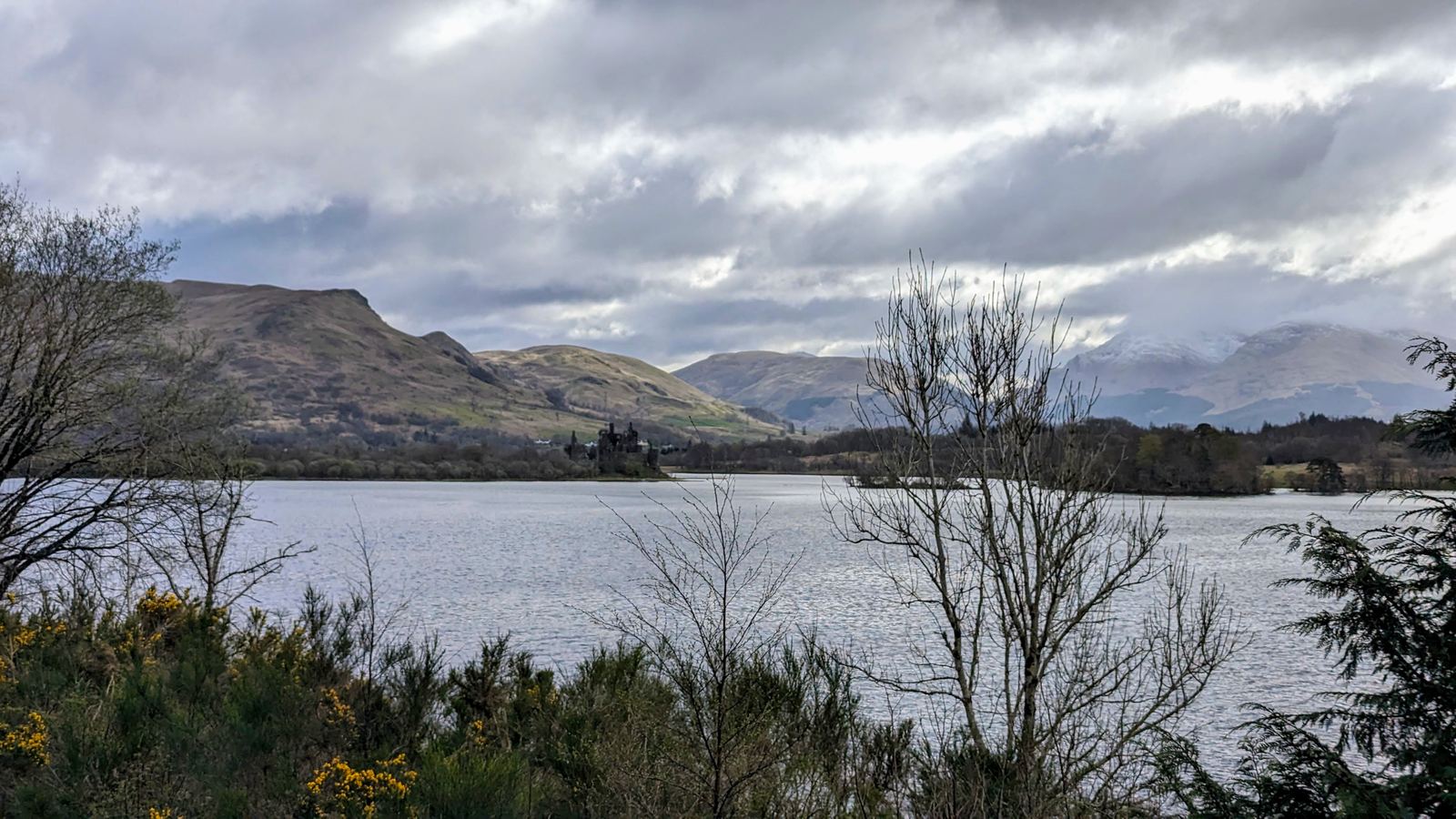 Kilchurn Castle in the distance across Loch Awe, mountains all around.