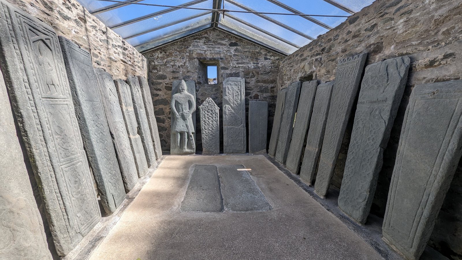 A moss-covered carved grave-slab at Kilmartin.