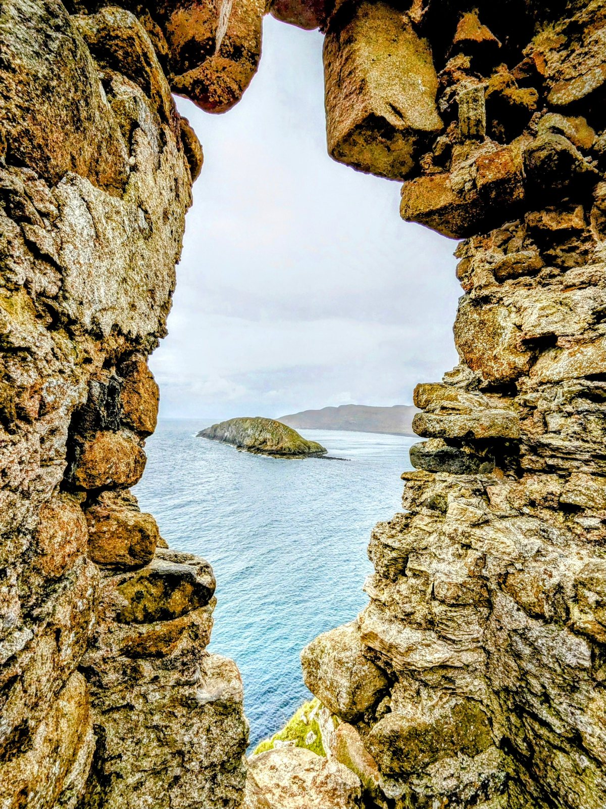 The coast framed through an old ruined window at Kilmuir.