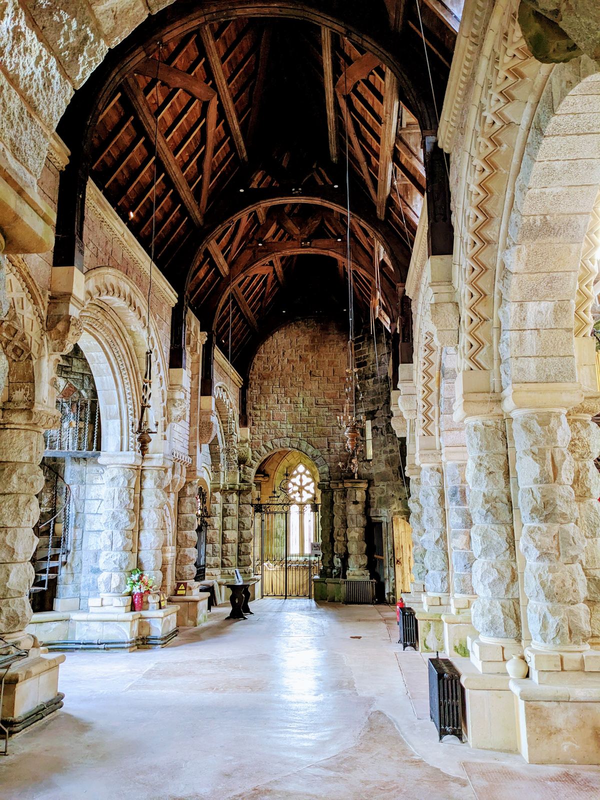 Carved Romanesque stone arches inside St Conan&rsquo;s Kirk.
