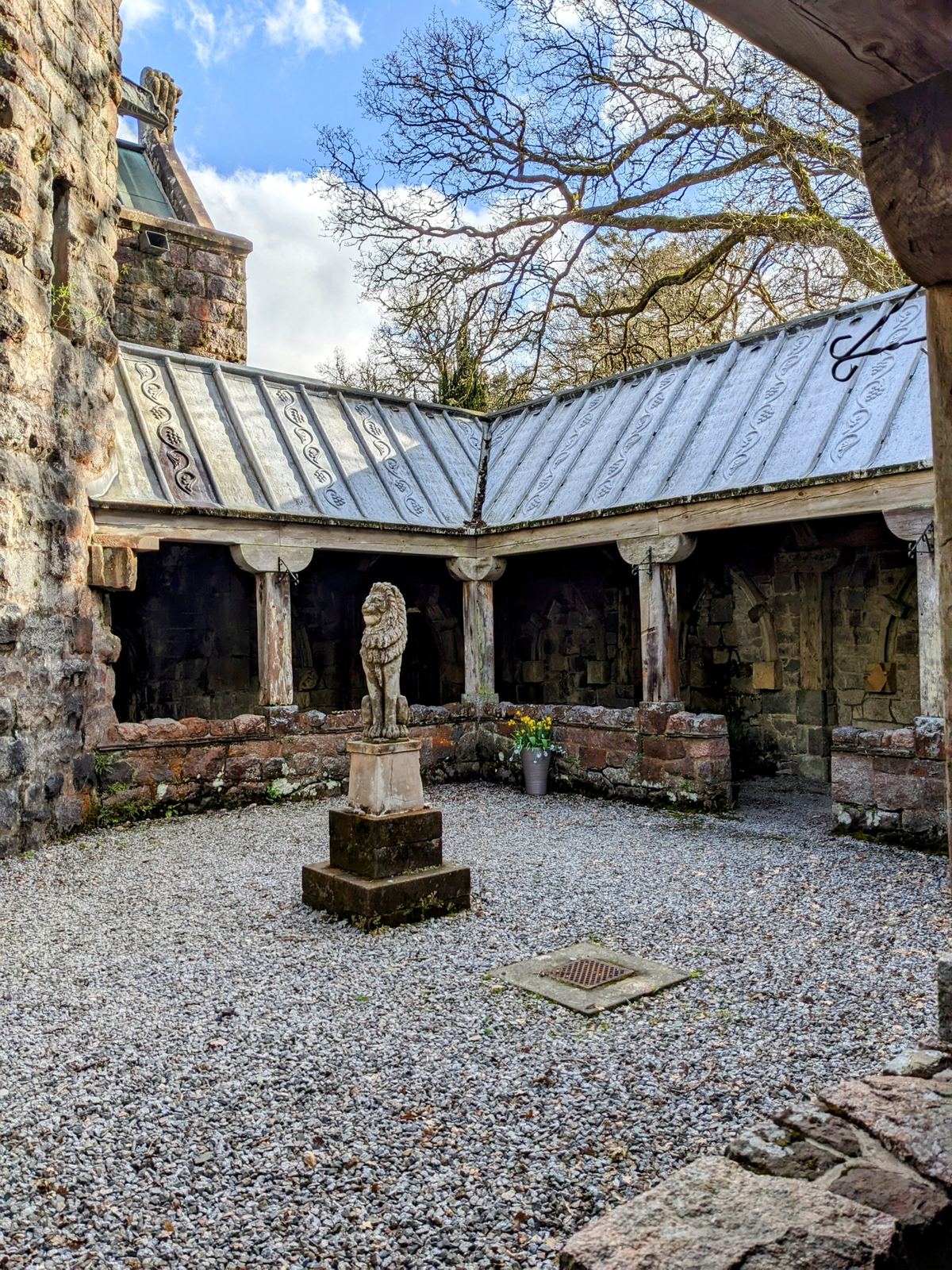 The cloister courtyard of St Conan&rsquo;s Kirk, Loch Awe beyond.