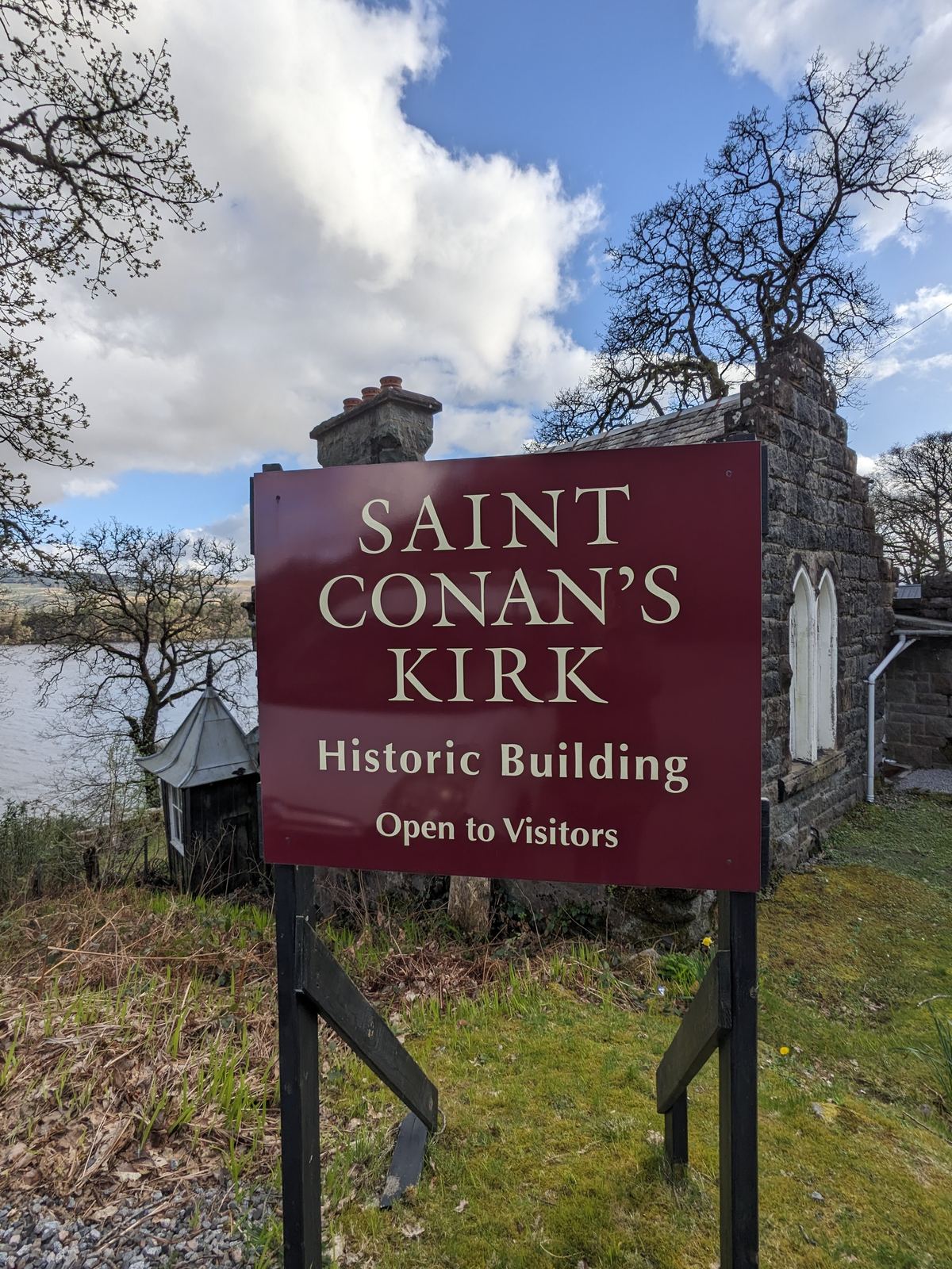 The Saint Conan&rsquo;s Kirk sign on the shore of Loch Awe.