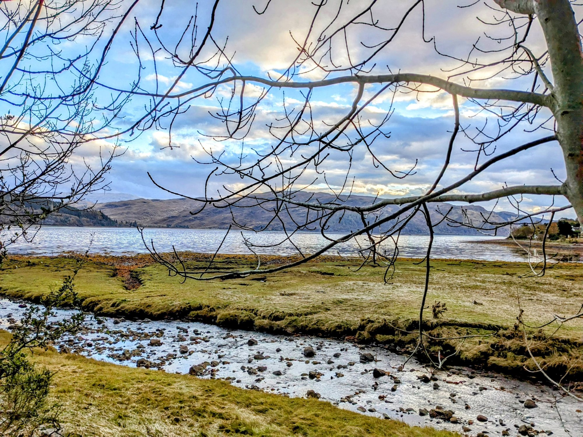 The strath and river at Strathcarron with snow-dusted hills, Wester Ross.
